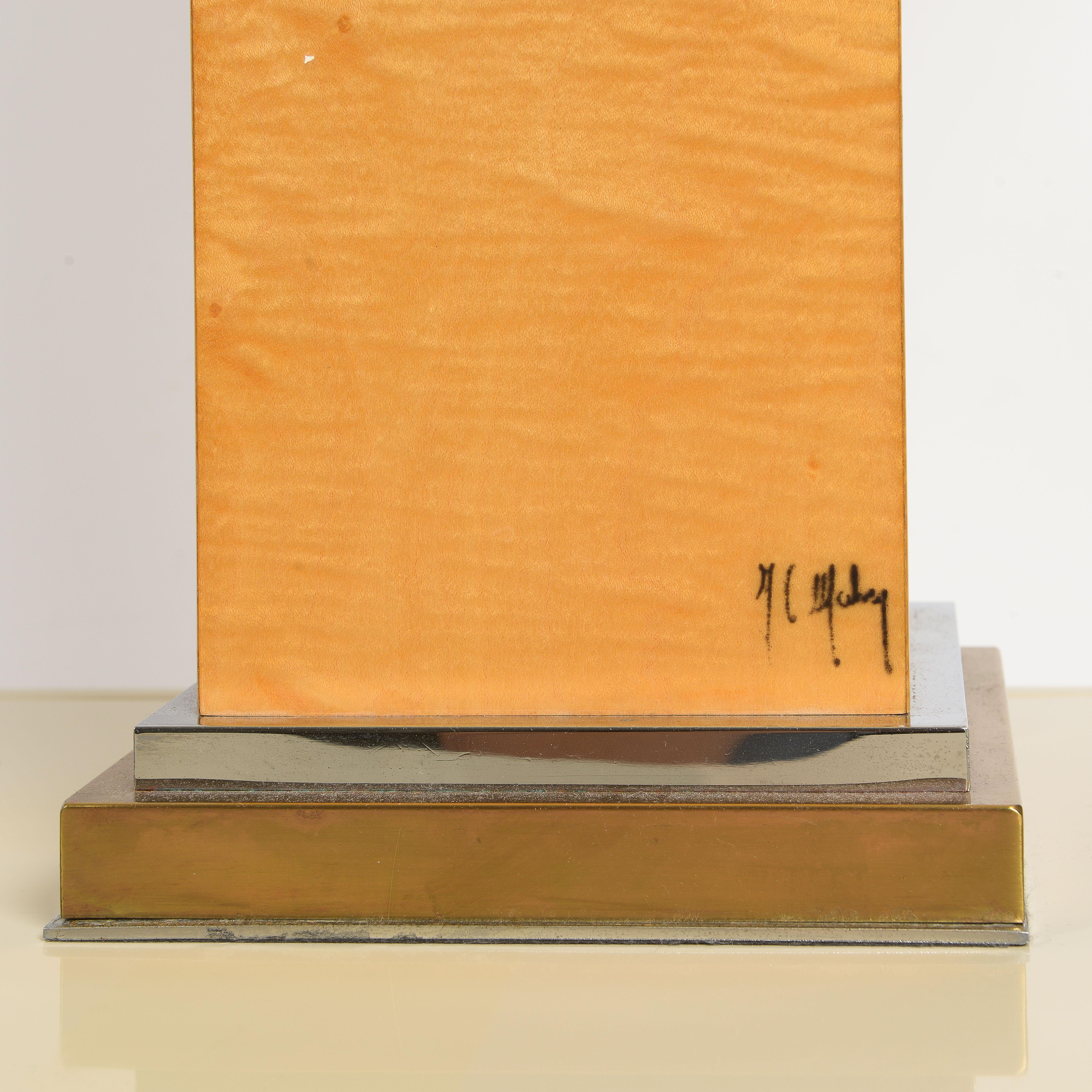 1970s Tall Rectangular sycamore base raised on a square brass base signed in lower right corner, France.
 L 20 ½  x H 34 ½  x W 20 ½  in 
Base: 8 x 8 in