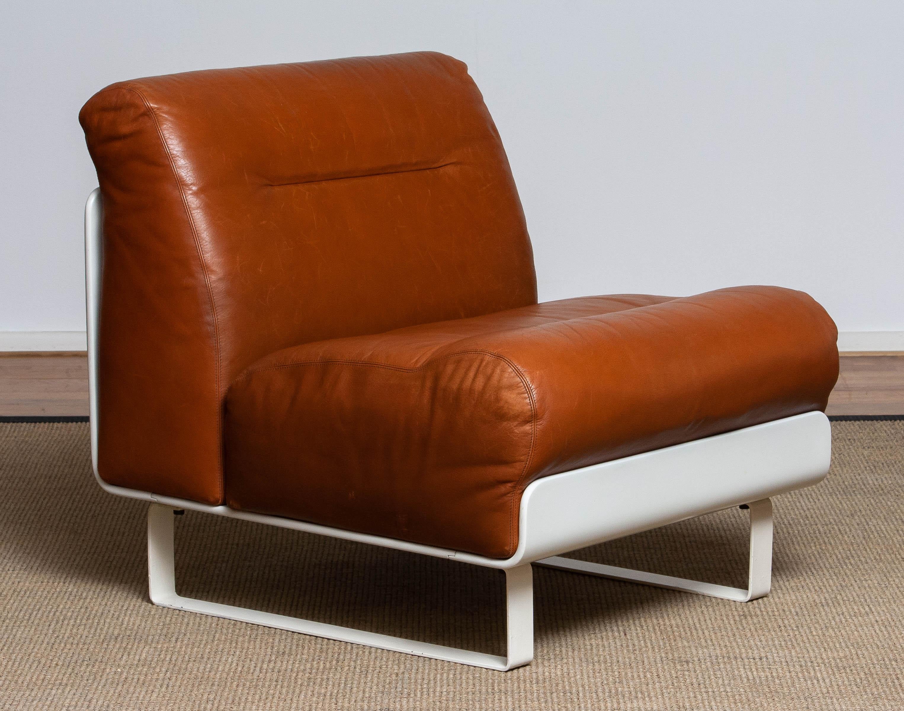 Absolutely beautiful Space Adge 'Orbis' element upholstered with cognac / tan color leather cousins with a beautiful patina true the years designed by the flamboyant Italian industrial designer Luici Colani for COR Germany.
The leather is in good