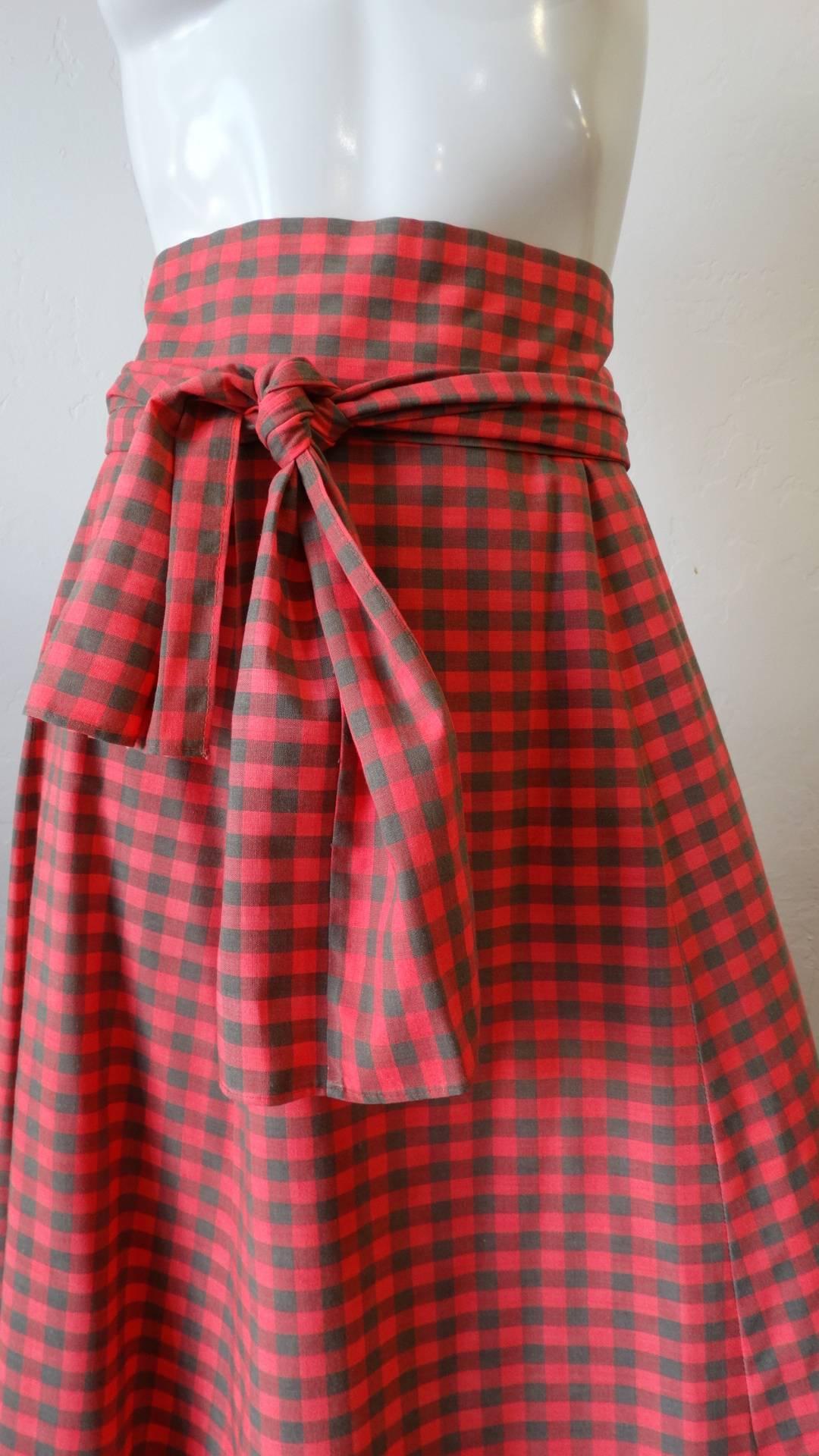 Plaid lovers rejoice- the perfect tartan skirt has arrived! This adorable 1970s plaid skirt features a high waisted fit and flattering maxi length- perfect for pairing with cropped peasant tops all summer long. Made of a red and green plaid cotton