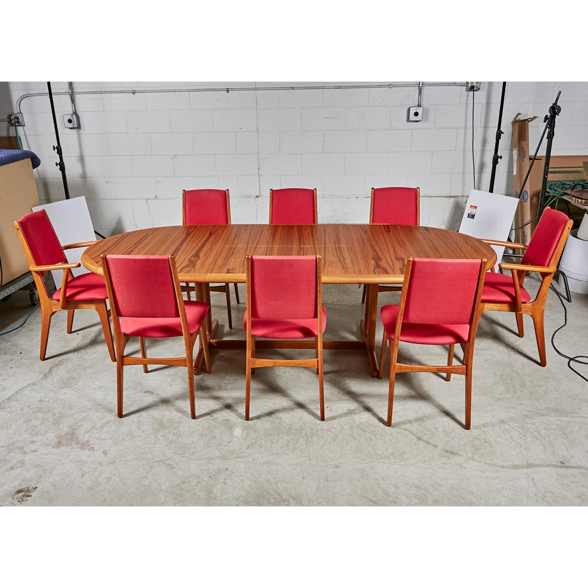 Vintage 1970s Danish teak oval dining room table with Canadian teak set of 8 dining room chairs. Measures: Inside fold out leaf: 31.5in.W. Fully open table: 99.5in.L. Arm chairs(2): 21in.L x 22.5in.W x 36.5in.H. Arms: 27in.H. Seat:19in. H. Chairs