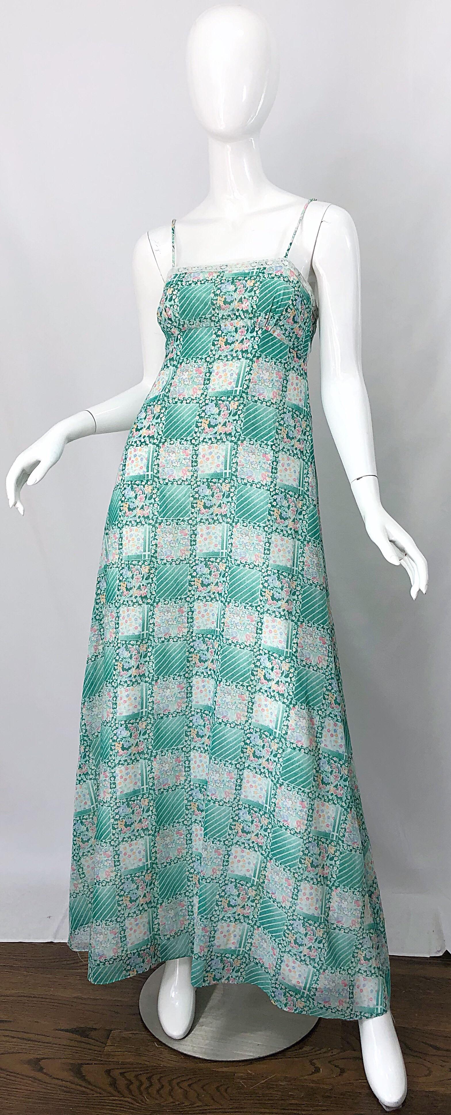 Beautiful vintage 1970s teal green / blue and pink cotton and lace maxi dress! Features a fitted spaghetti strap sleeveless bodice trimmed in lace on the front and back. Forgiving and flattering full length full skirt. Printed squares features