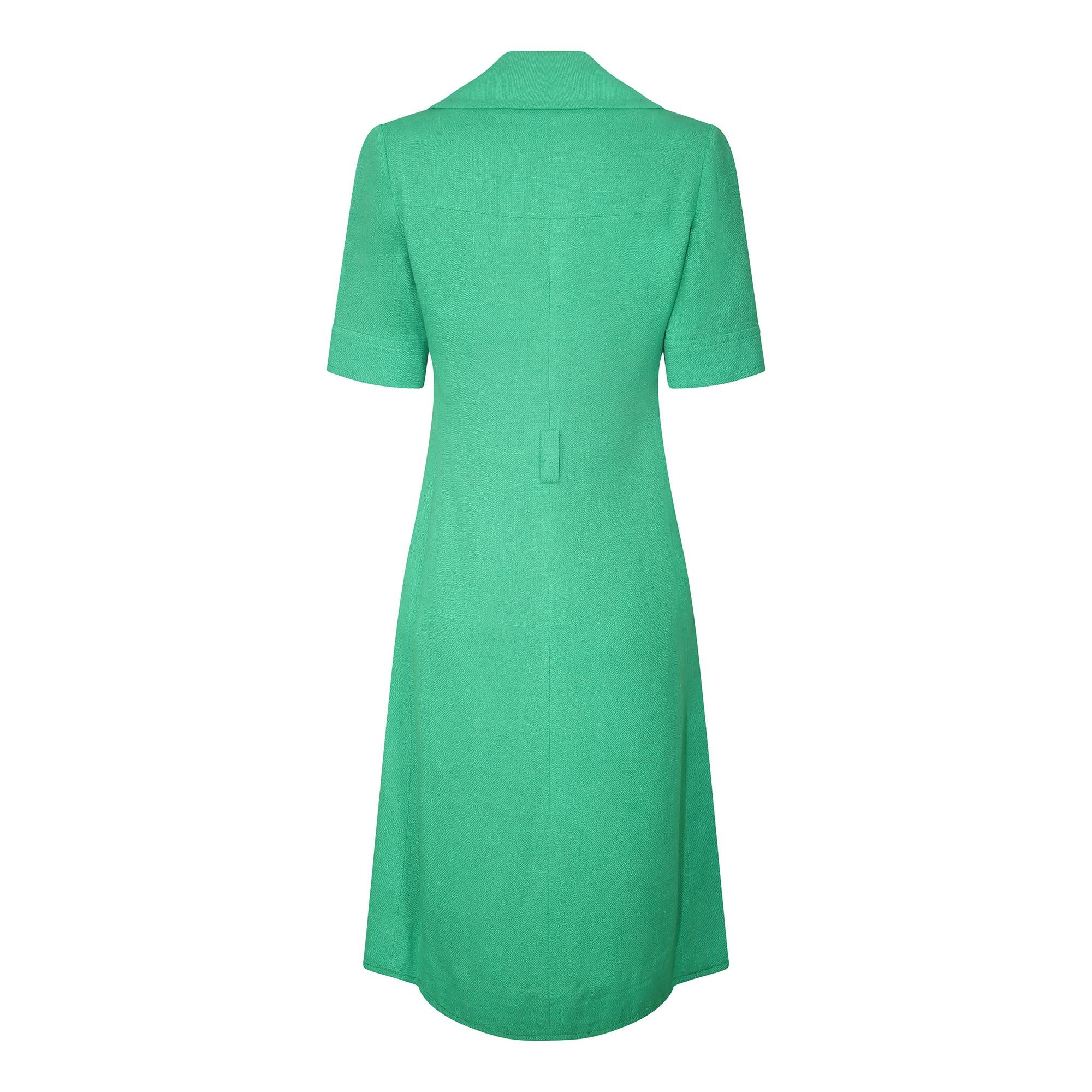 This is a great example of early unisex fashion from the revered French designer Ted Lapidus.  He popularised sports utility wear and the safari suit look along with Yves Saint Laurent in the 60s and 70s.  This dress is made from a richly woven