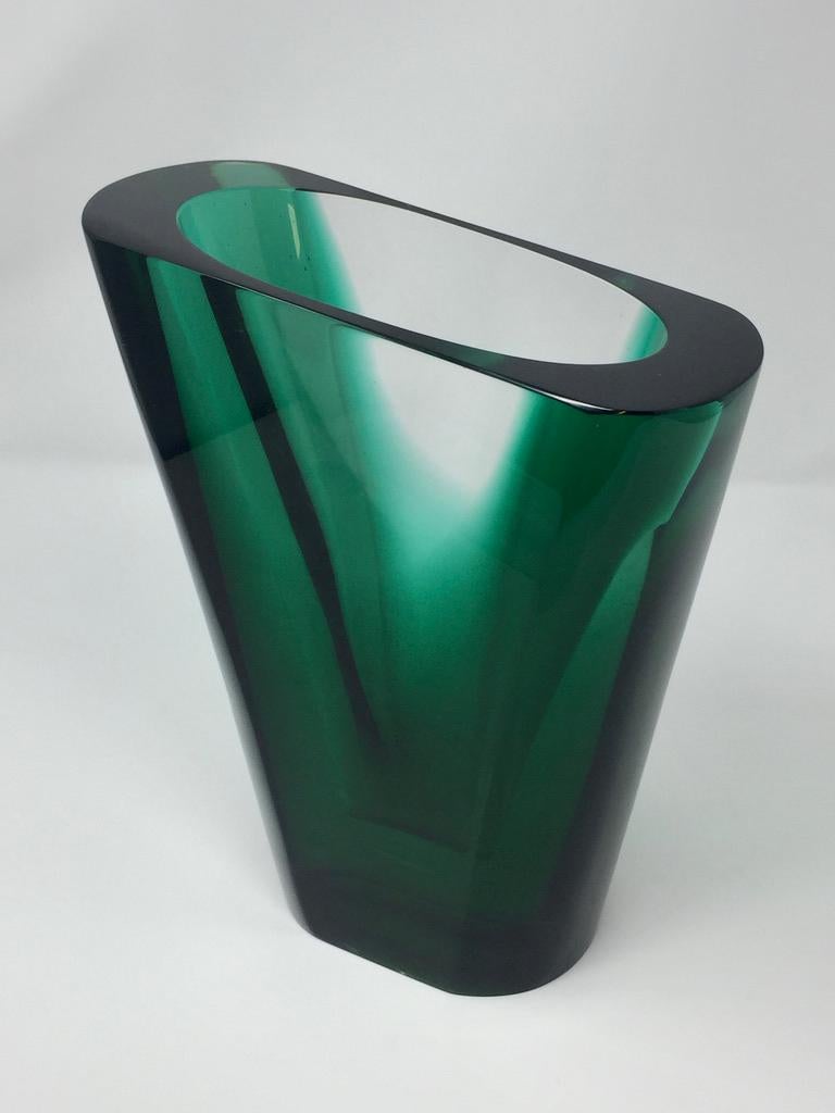 Sculptural vase in green and clear glass, with striking angled neck. 
There is a very small internal bruise to the rim (seen in the last photo).