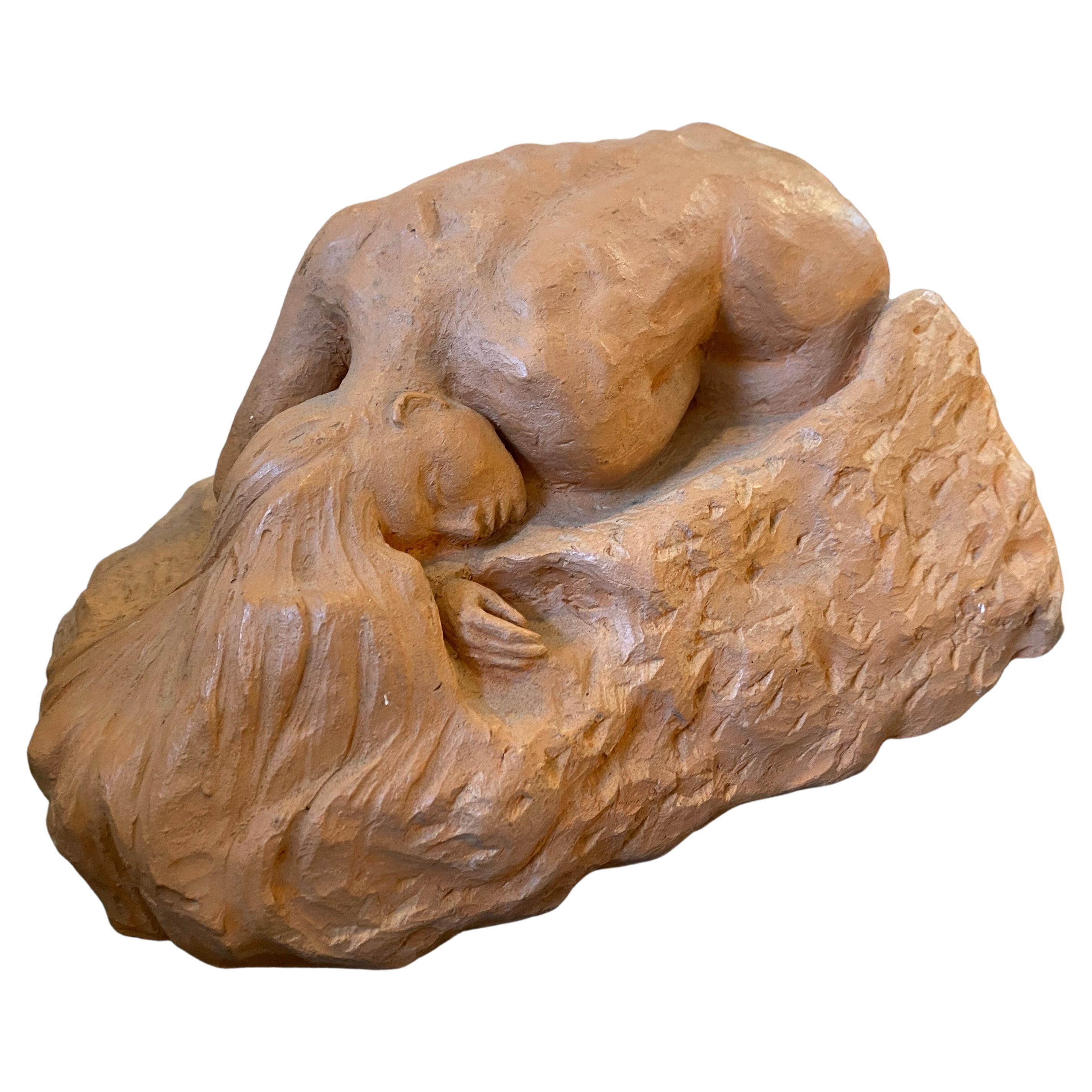 A Sicilian Sculpture by Tudisco created in the 1970s, in very good conditions, signed on a side. The sculpture portrays a lying naked woman 
Terracotta is a type of clay-based ceramic material that has been widely used throughout history for
