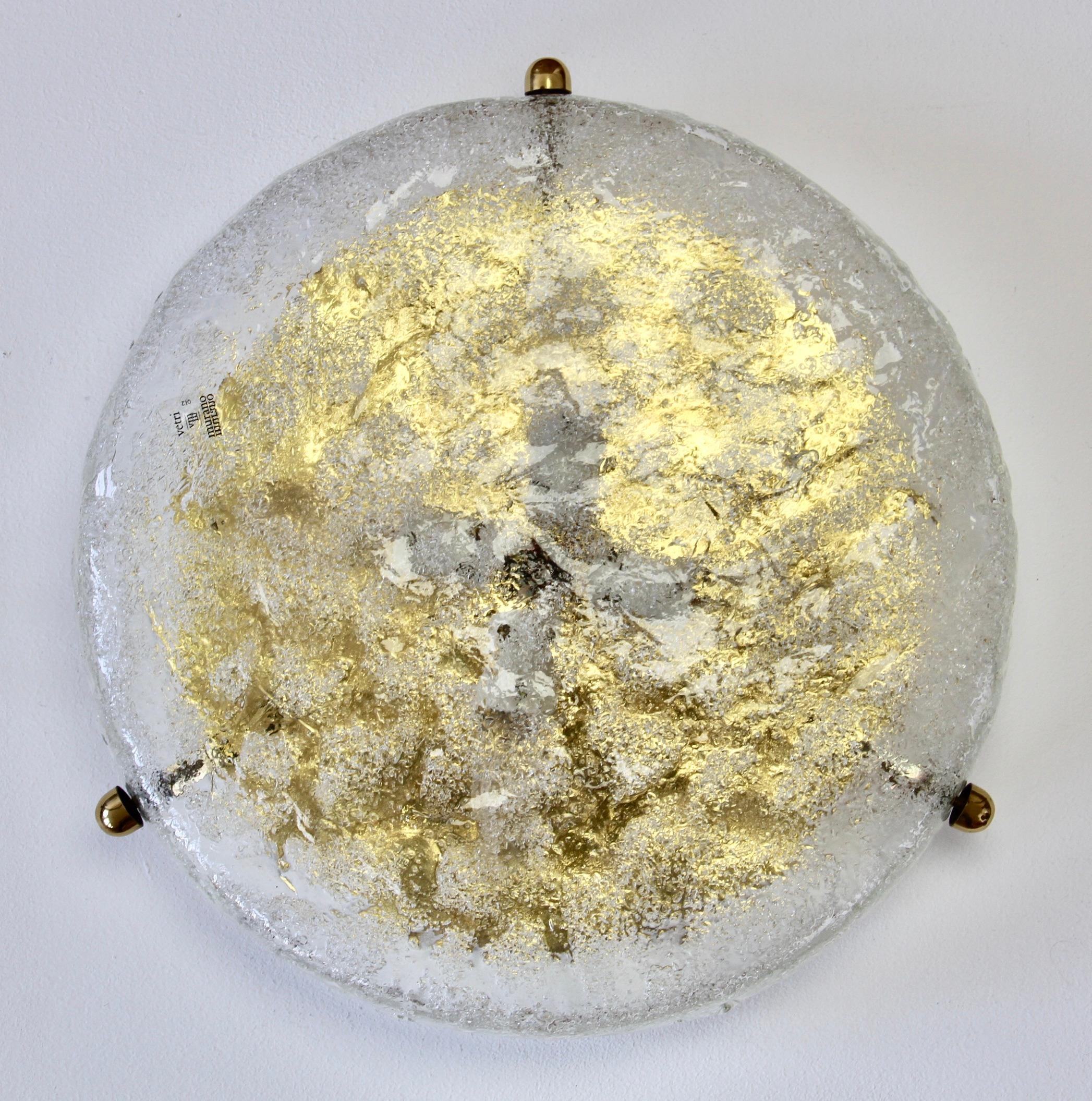Stunning Mid-Century Modern textured ice glass flushmount light fixture by German manufacturer Hillebrand, circa 1965.This vintage ceiling lamp, often mistakenly attributed to Kalmar, features a huge round glass dish is made of Italian 'Frit' Murano