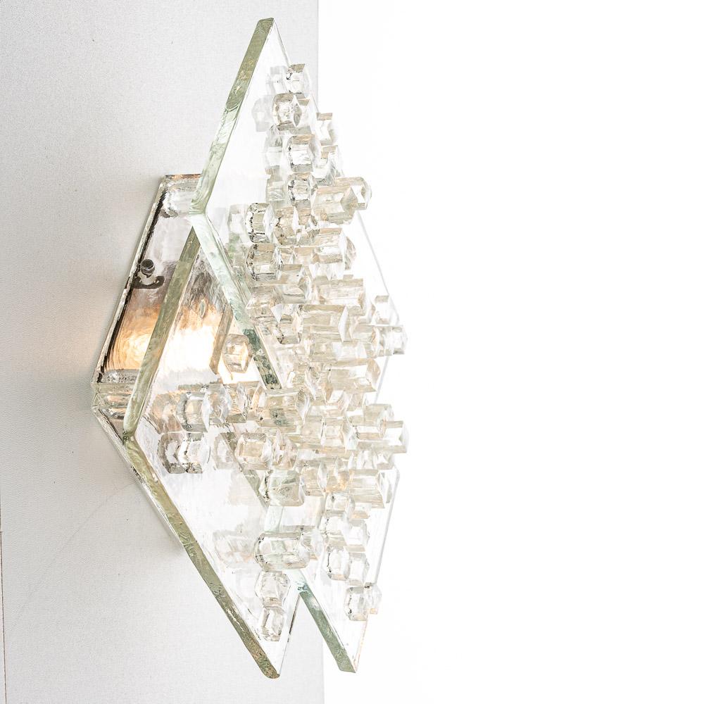 This lamp is made of thick squares of raw crystal glass with glass cubes placed in a graphic pattern.