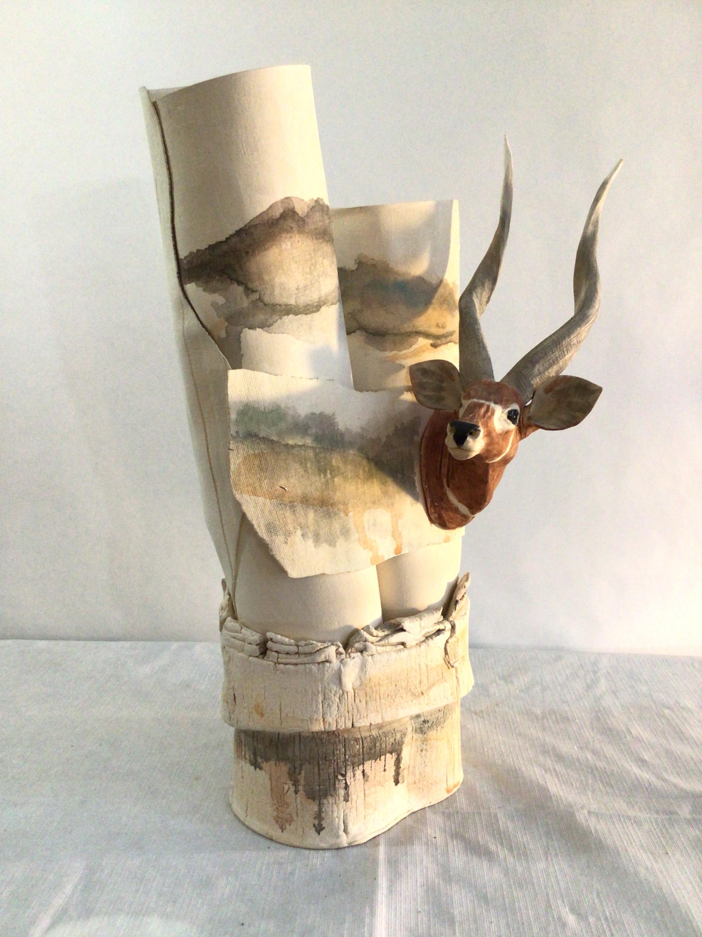 This Unique 1970s Thin Wrapped Pottery Sculpture features an Antelope or Gazelle with Black Glass Eyes
Parts of the pottery have texture resembling cloth/fabric 
Pottery Has A Stamp and the marking '79 
Colors: Cream, Earth tones, Watercolor,