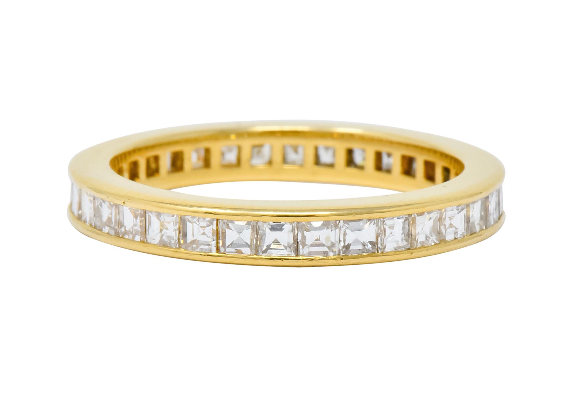 Eternity style band centering square step cut diamonds weighing 1.20 carats total, F/G color and VS clarity

Channel set fully around with high polished channel walls

Signed T & Co. for Tiffany & Co. and stamped 750 for 18 karat gold

Circa