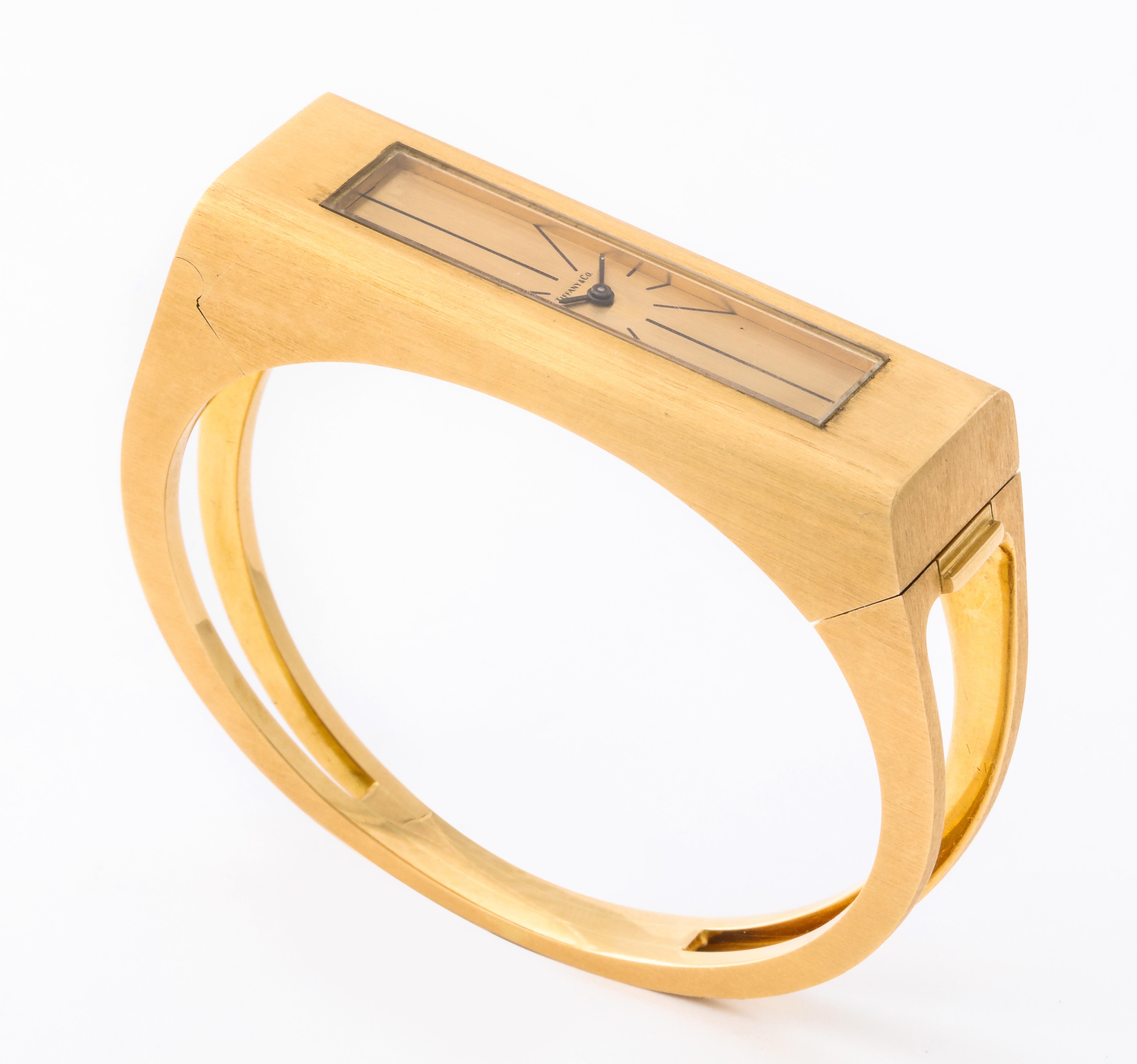 As much a bracelet as it is a watch, this pieces is a great example of the decorative arts of 1970's.  The elongated (2 inches long by 2/3 of an inch wide) watch case blends naturally into the curved bracelet.  Made in France and with a movement by