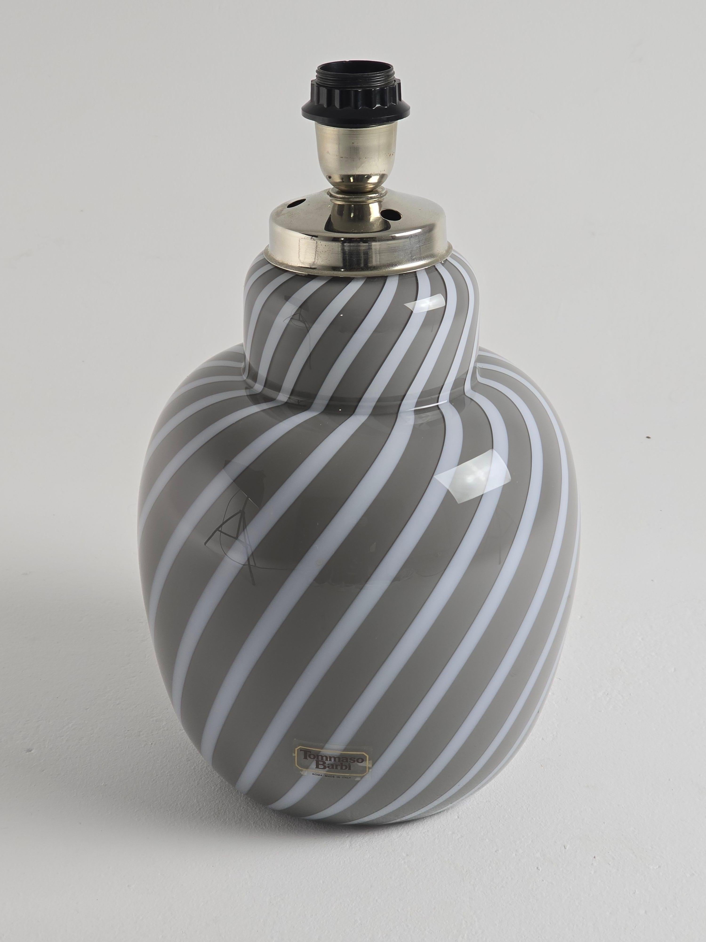 Elegant swirl motif glass table lamp mouth blowed  by  Tommaso Barbi . 

Please look at motif  begining under  and notice how that pattern end up on visible part of the lamp  . AMAZING !

Contain one E26/E27 Edison base socket . 

Wiring , Switch