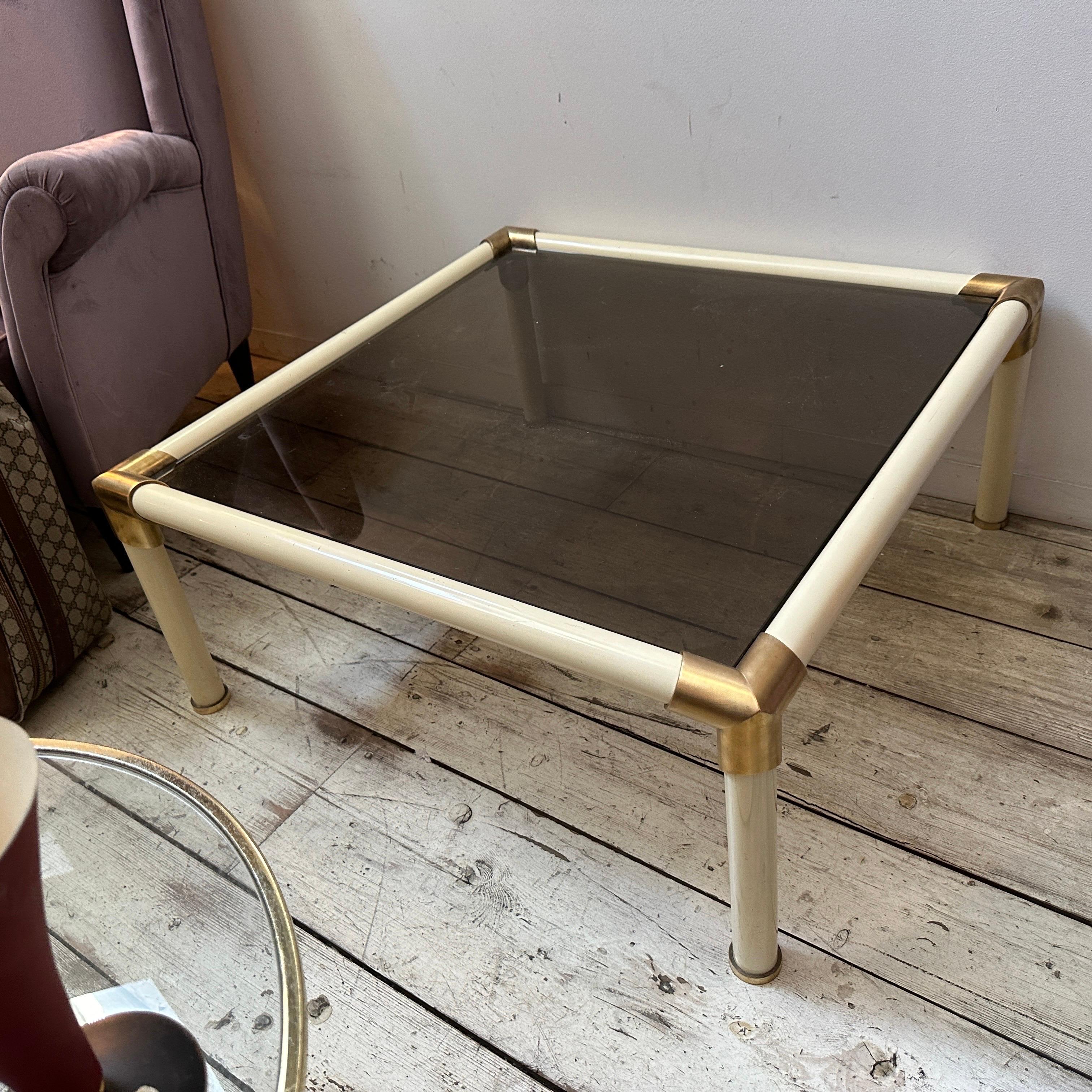 This 1970s Tommaso Barbi coffee table exemplifies the opulent and sculptural design aesthetics of the Mid-Century Modern period. This square coffee table combines luxury and minimalism, showcasing Barbi's signature use of bold materials. The table