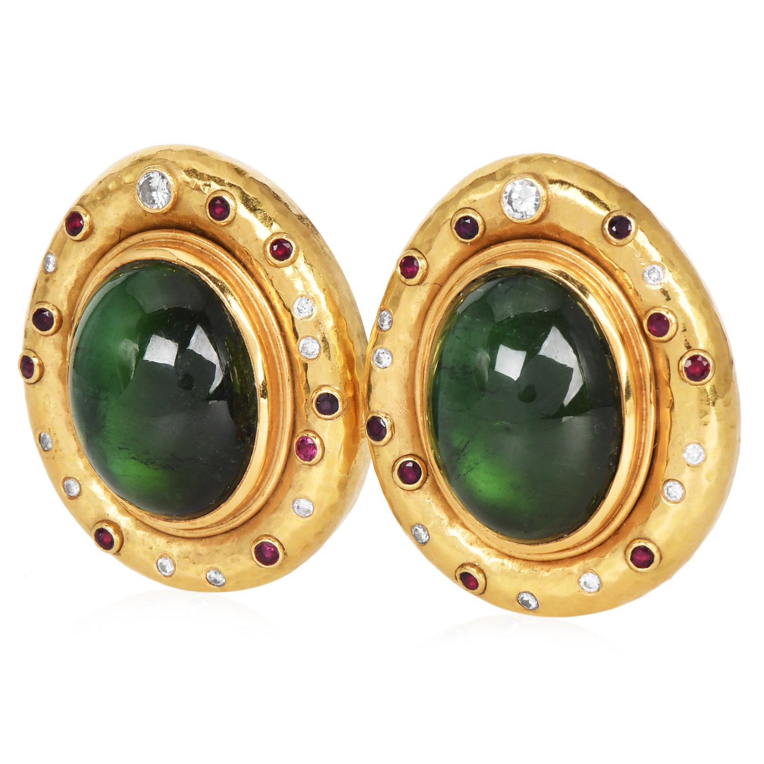 Circa 1970s Large 18K Yellow Gold Oval Cabochon Peridot Statement Earrings, a striking pair of vintage earrings.

Each earring features a stunning oval cabochon Peridot, totaling approximately 35.00 carats; bezel-set, framed by a hammered textured
