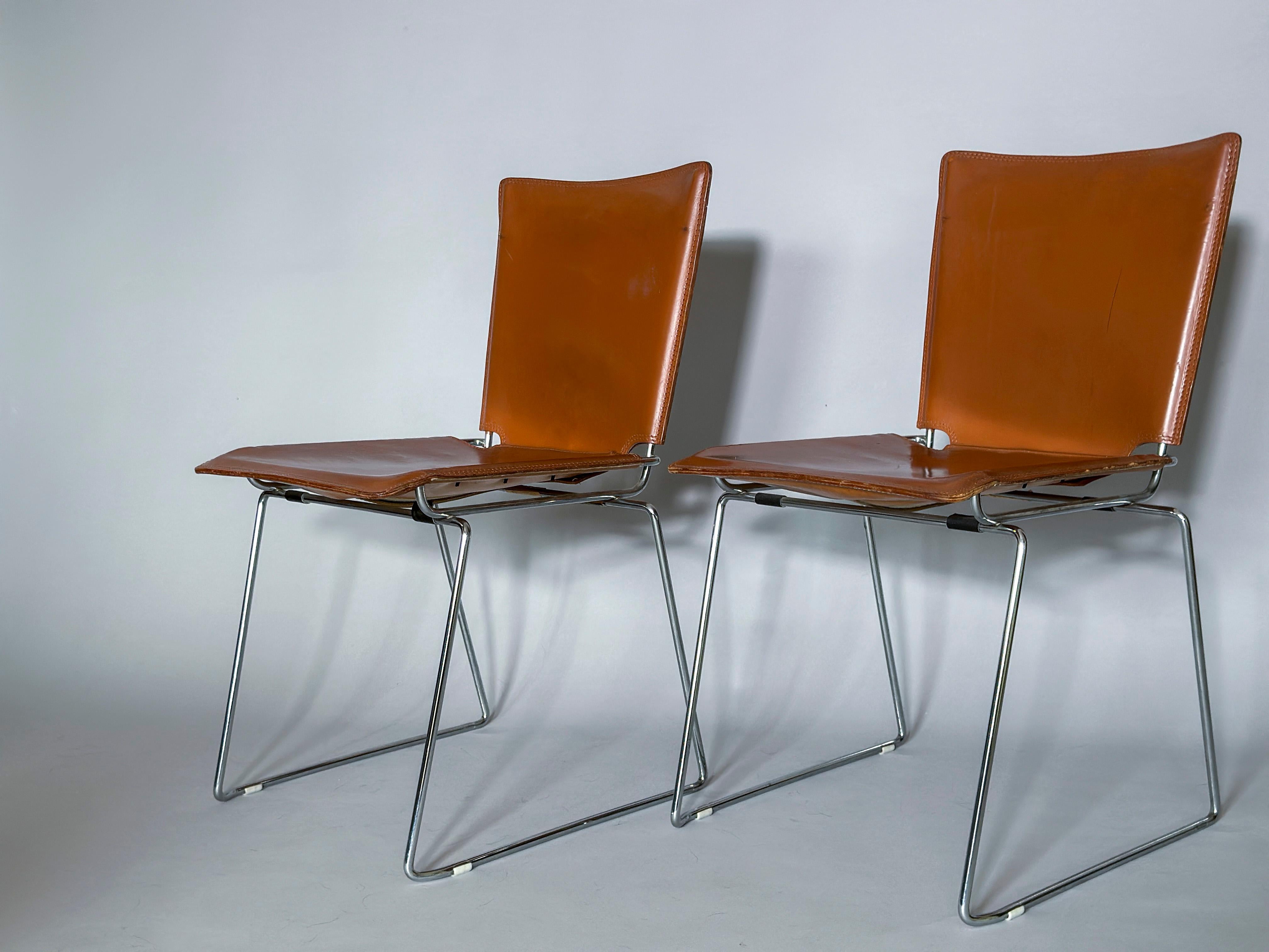 Available 4 pelle stacking leather chairs, designed by Toyoda Hiroyuki for ICF. 

Tanned leather saddle covering a heavily chromed base. Wonderful details of stitched and laced leather. 

The chairs can easily be stacked in groups or put