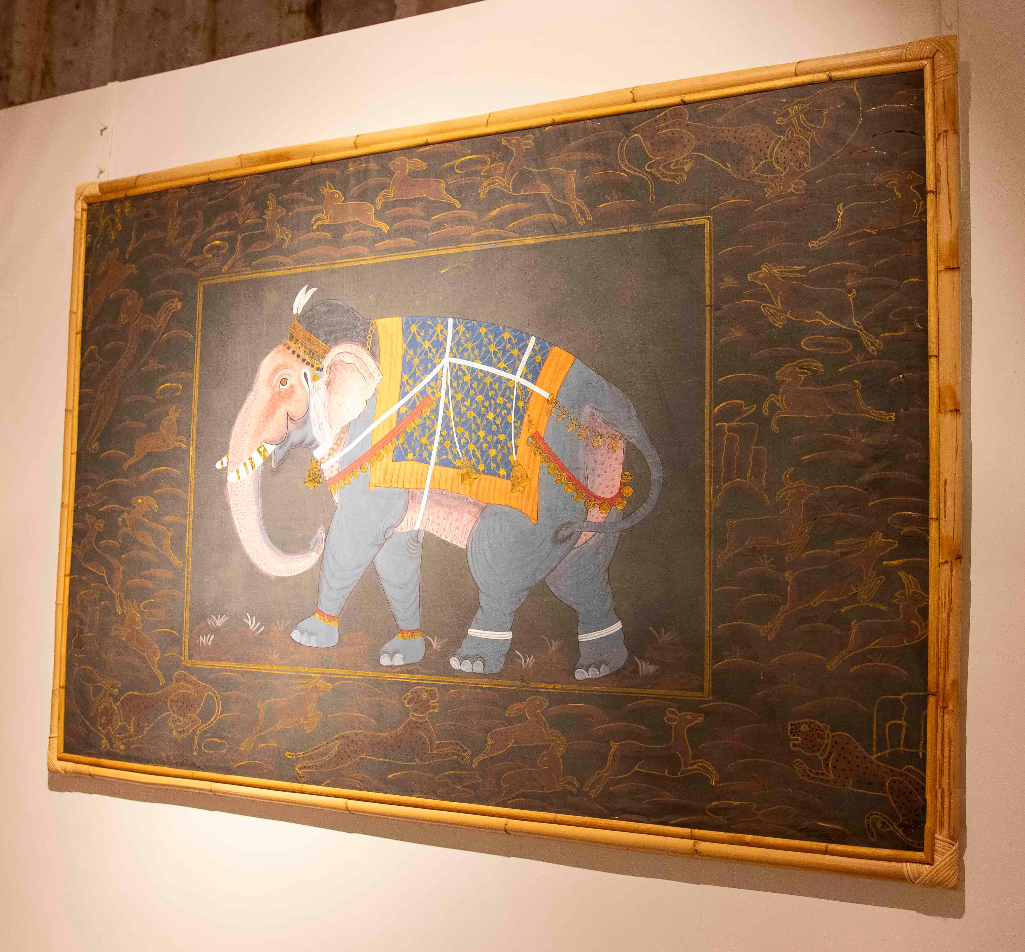 A magnificent Rajasthani-style Indian painting depicting a richly decorated elephant, a symbol of royal power and a protective deity in the traditions of the subcontinent. The work shows the animal in profile, with golden ornaments, brightly colored
