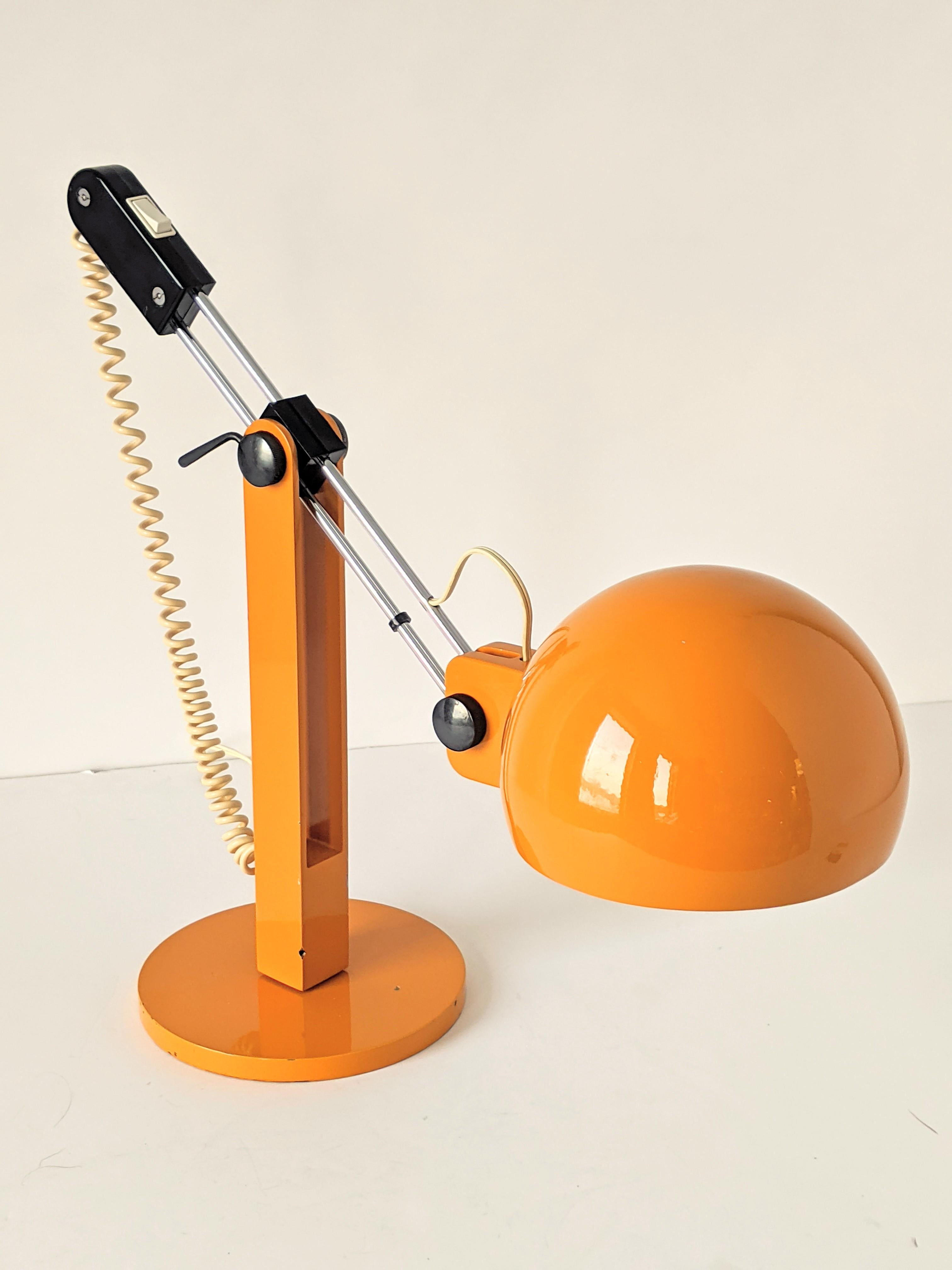 Strurdy well made table lamp by Miguel Milá for Tramo.

Prime quality material and thick solid hardware. 

Black bakelite ( not plastic ). 

Extremely agile it does move, slide ( trombone like ), tilt, angle in all direction and lock in a very