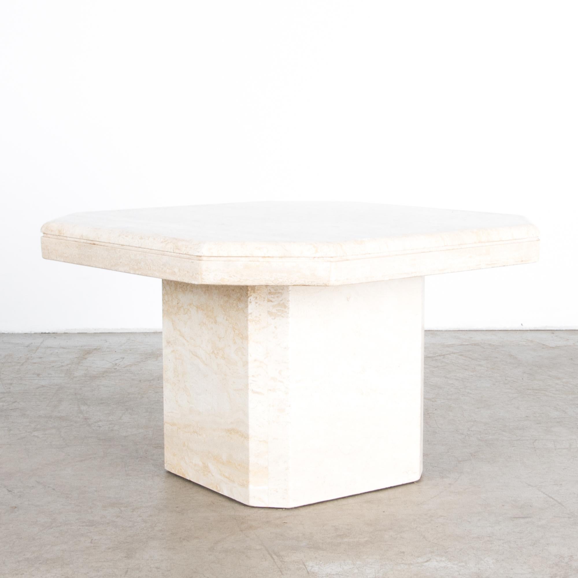 A refined travertine coffee table or pedestal, with octagonal square top and bevelled base. Thick proportions accentuate the weight of the stone, at a convenient 15” height. A material rich in itself, echoing classical sculpture. Associations from