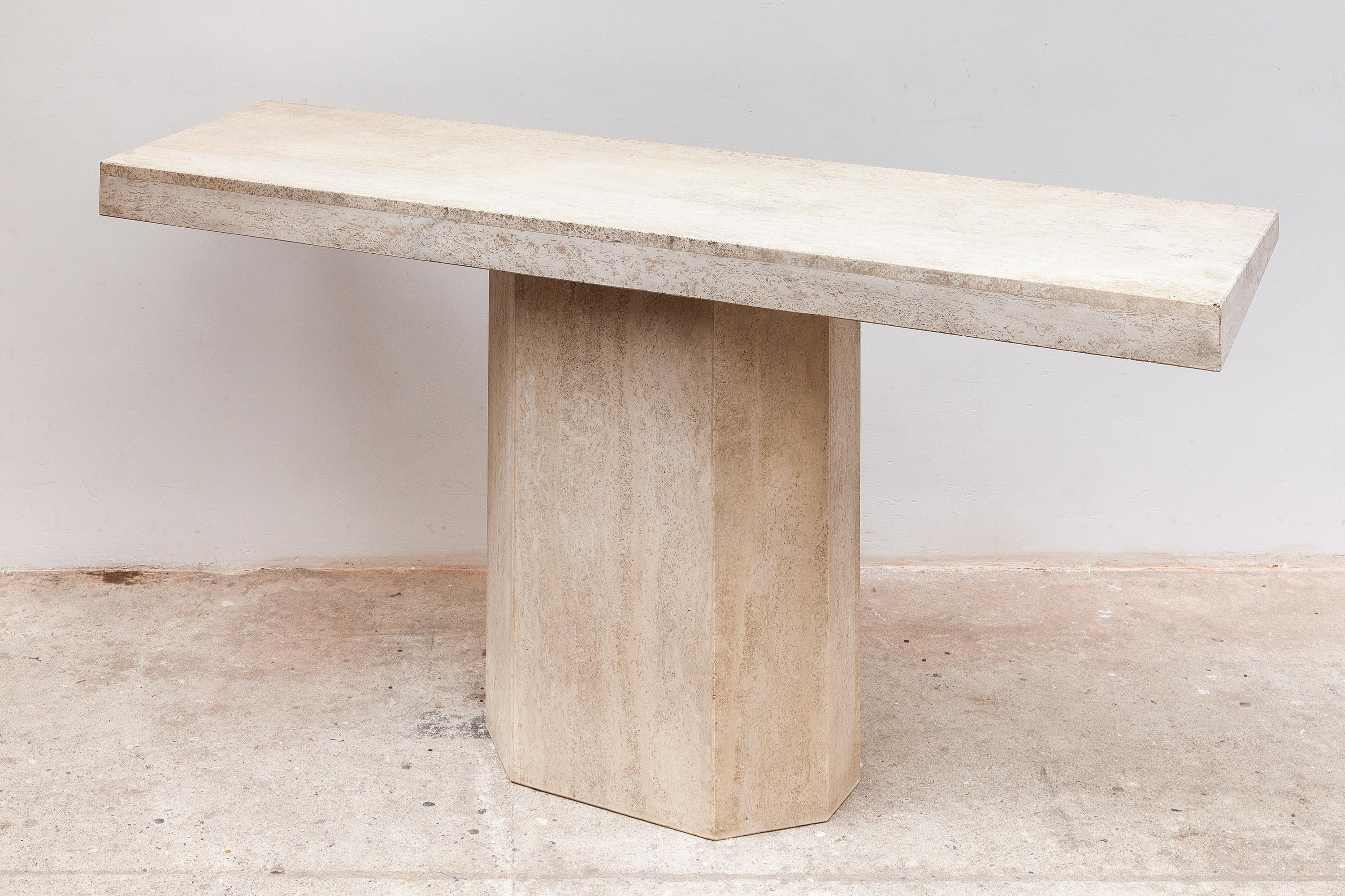 1970s travertine console or hall table. Warm beige color stone with faceted base. Dimensions: 140 W x 66 H x 40 D cm.