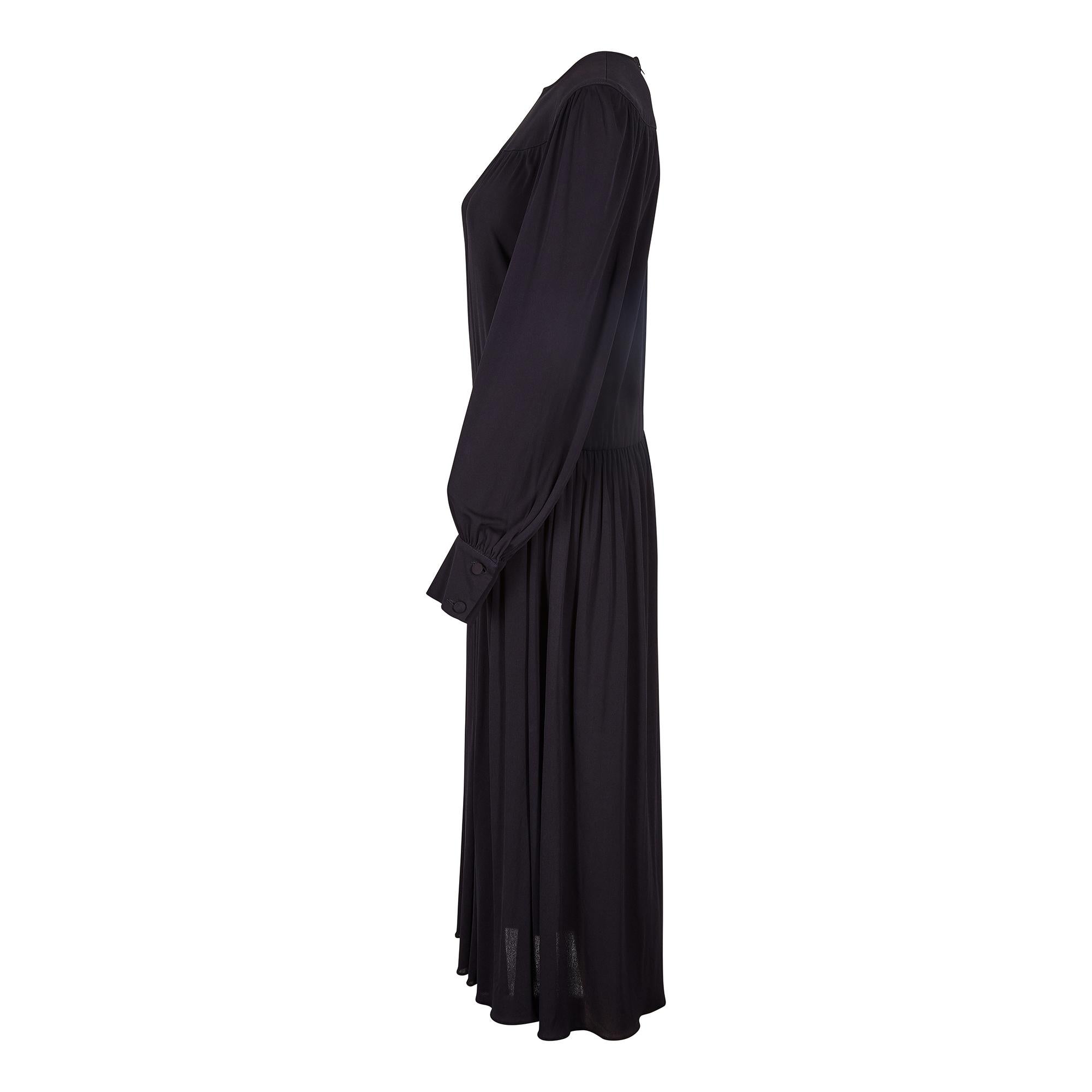 This is a really nice example of quality French wear from Tricosa and is a chic looking jersey dress inspired by Yves Saint Laurent’s collections of the mid-70s. It has a wide yoke neckline and the sleeves are gently gathered with double cuffs. The