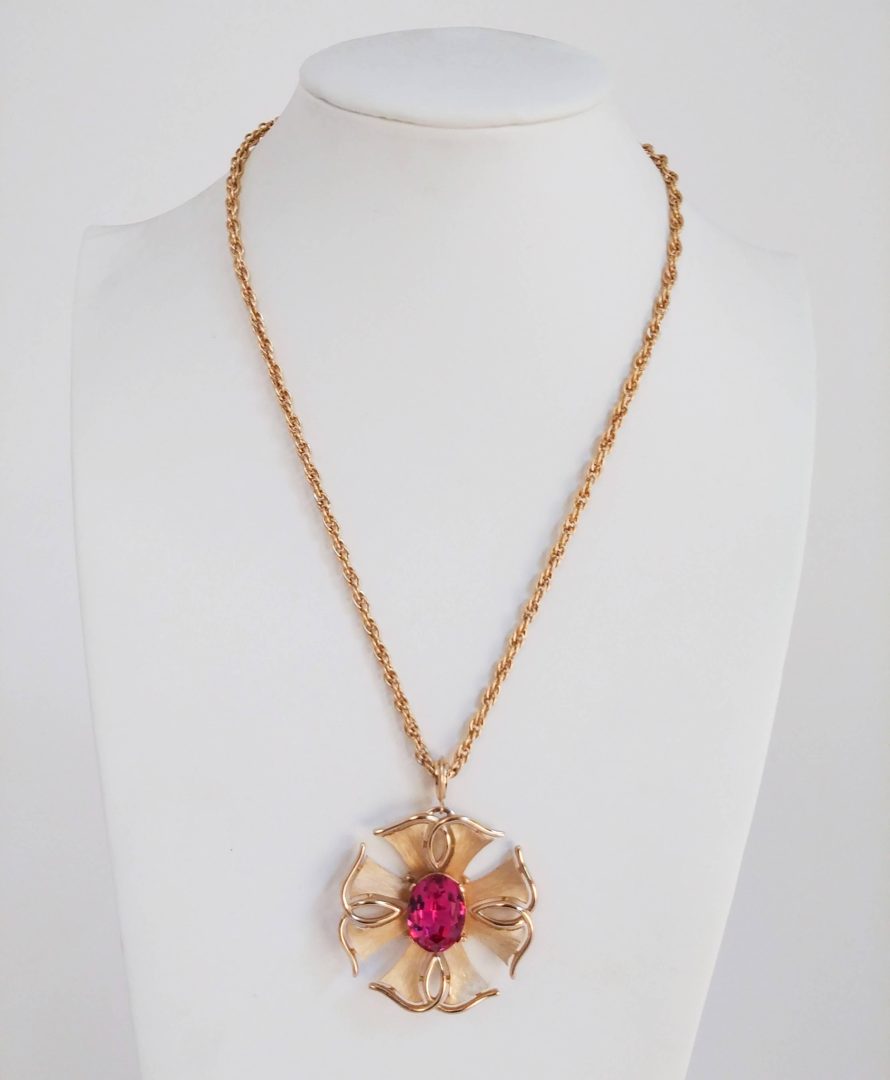1970s Trierai Magenta & Gold Pendant & Earring Set. Gold-toned jewelry set with large glass stones. Clip-on earrings. 