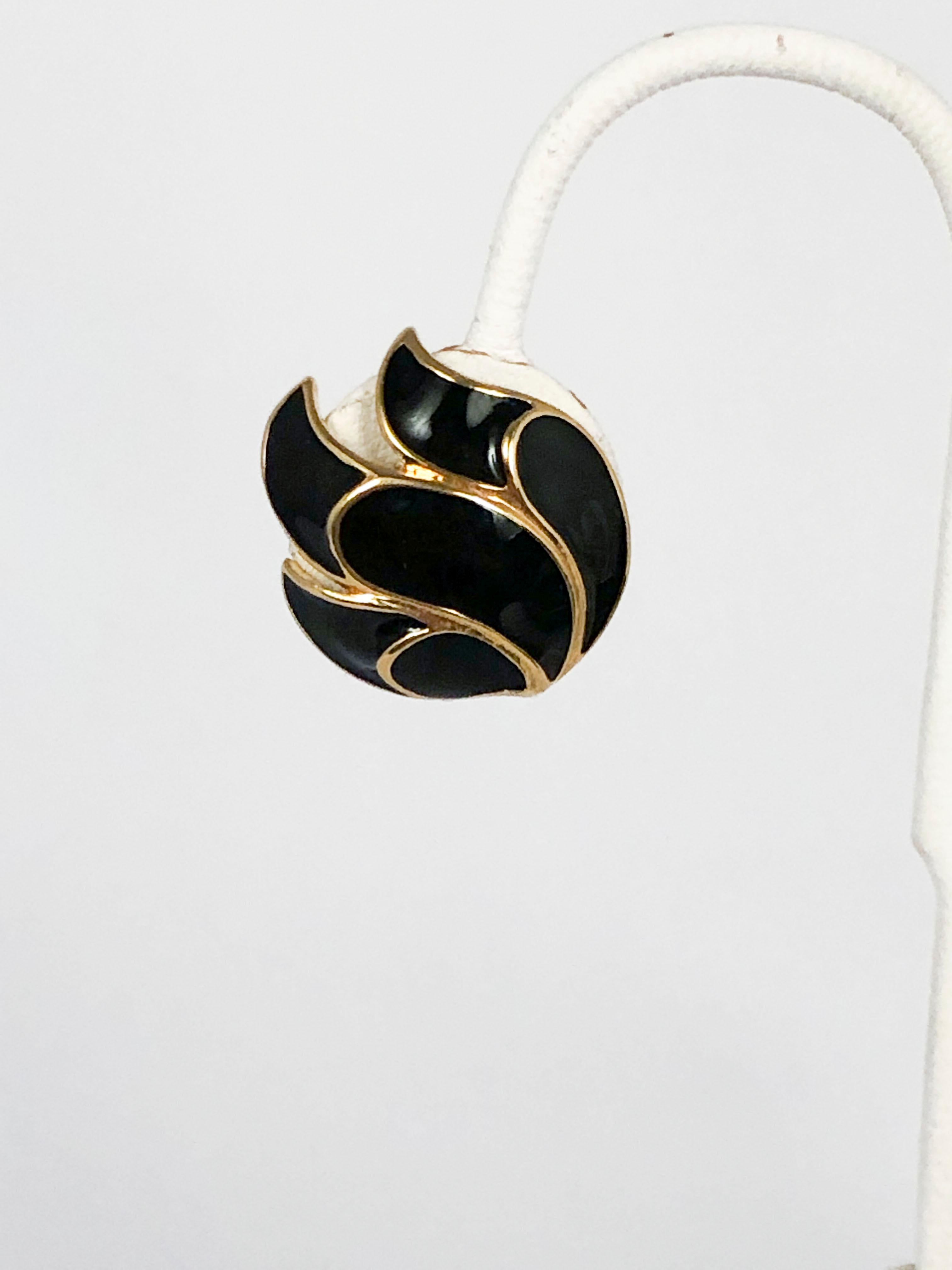 1970s black enamel clip-on earrings set in a gold-washed metal