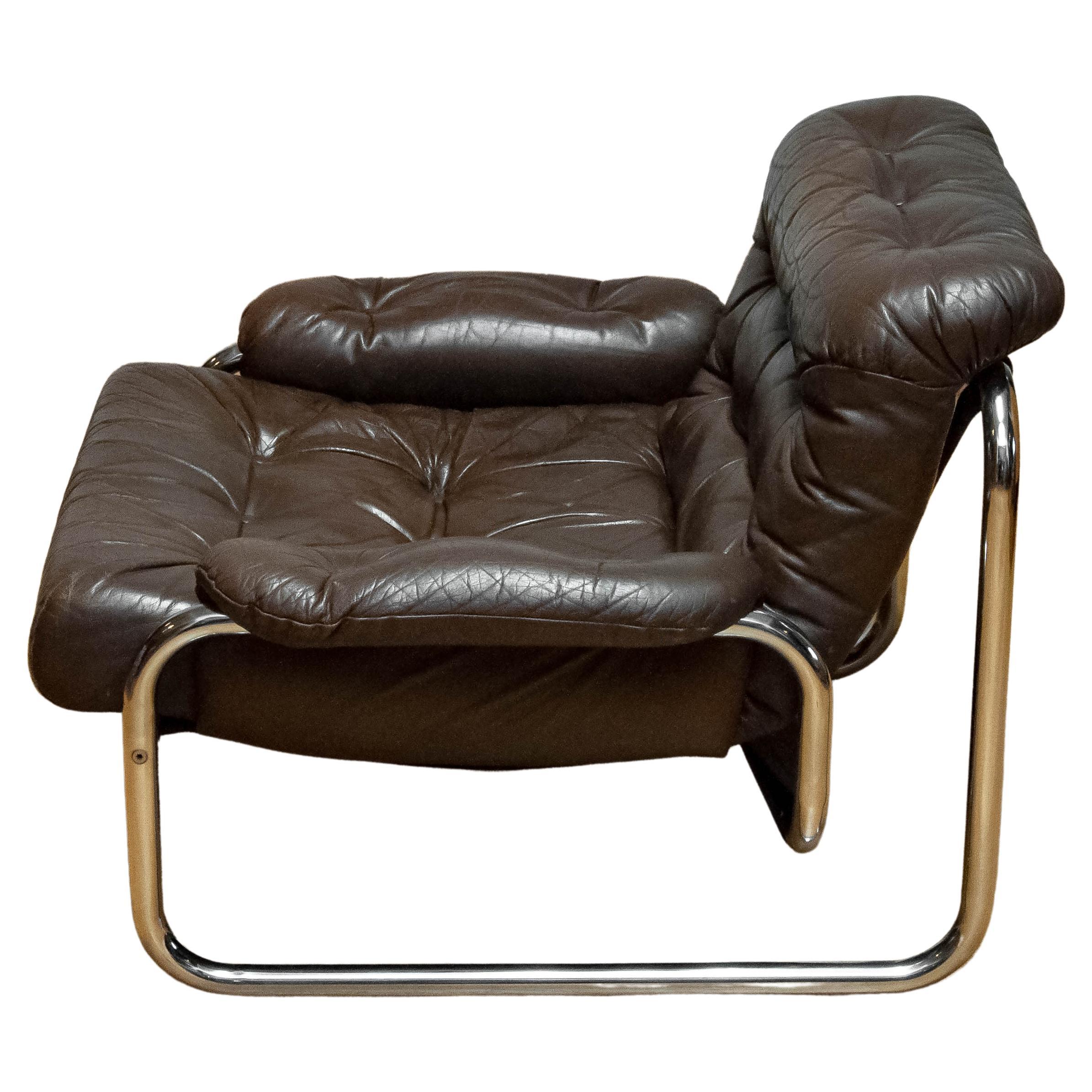 Beautiful lounge chair model 'Troligen' designed by Johan Bertil Häggström for Sved form Sweden
This chair is made of a tubular metal frame with brown leather cushion and armrests. The leather has a beautiful patina what gives the chair her