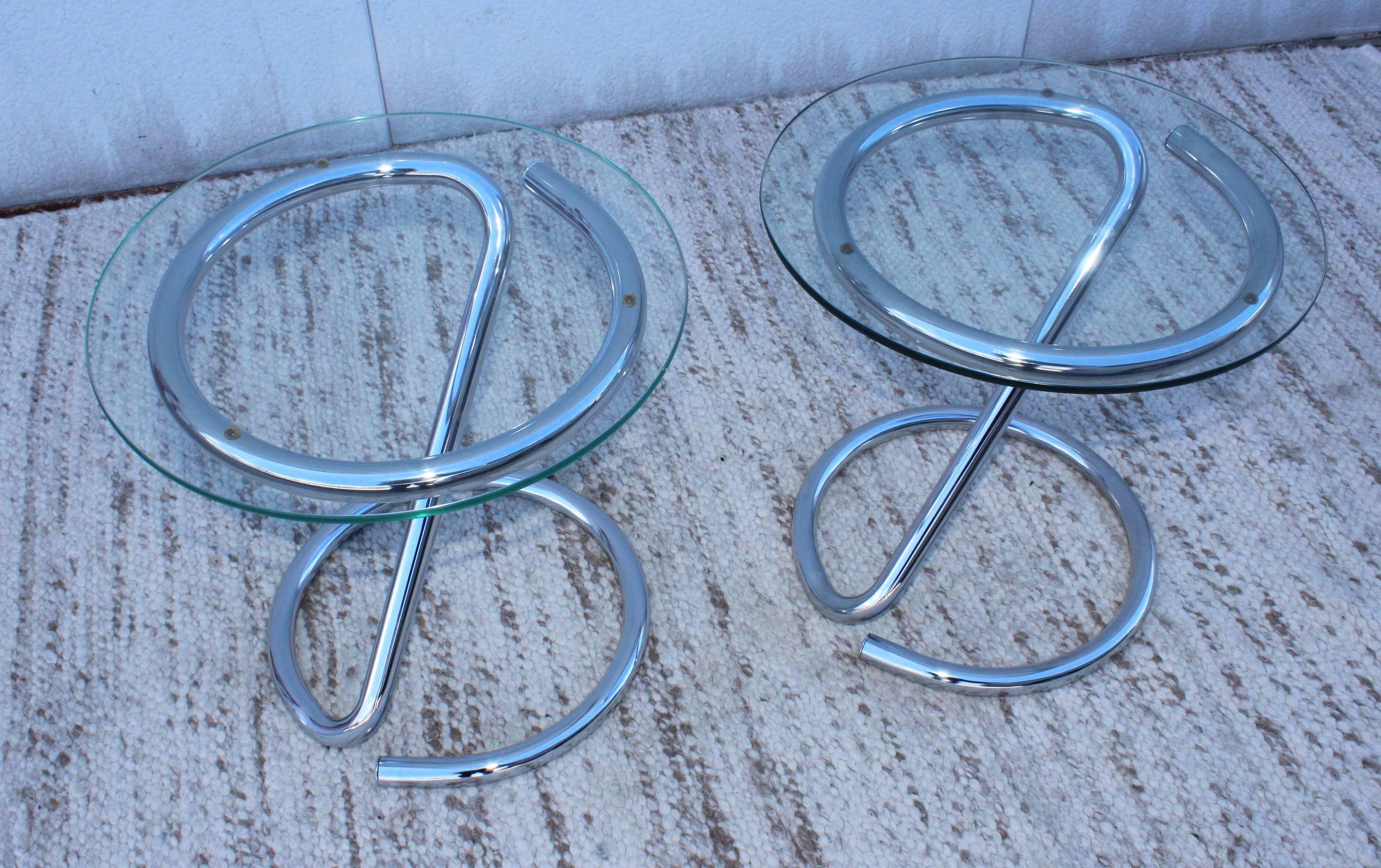 1970s tubular chrome side tables with glass tops.