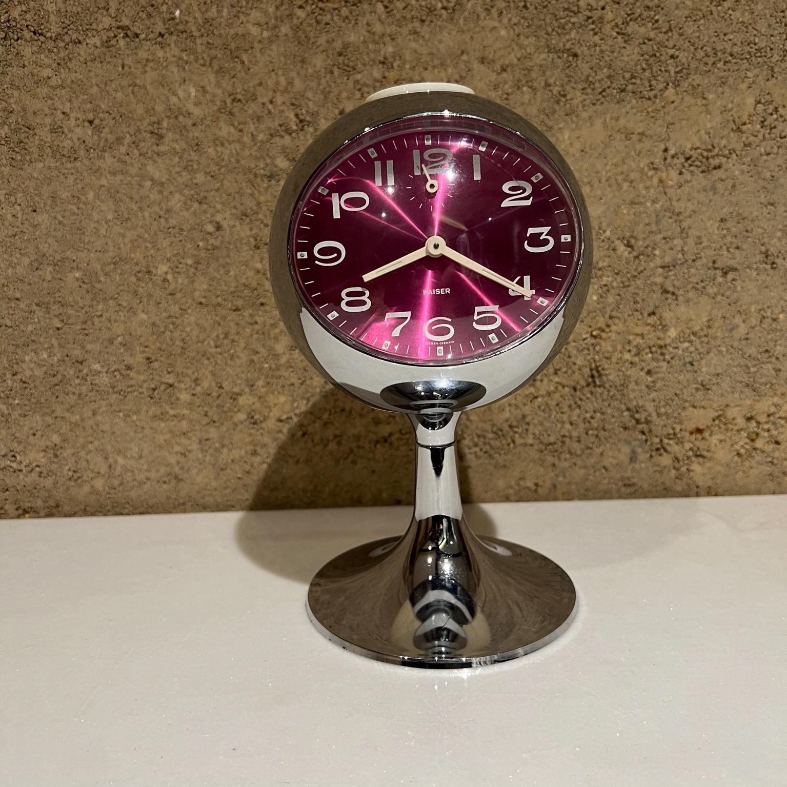 Tulip Space Age table clock made in West Germany by Kaiser.
Chrome and plastic style of Joe Colombo
Bright purple white and silver
8 tall x 4.5 diameter
Original preowned good working condition. Some scratches on plastic. 
Keeps accurate