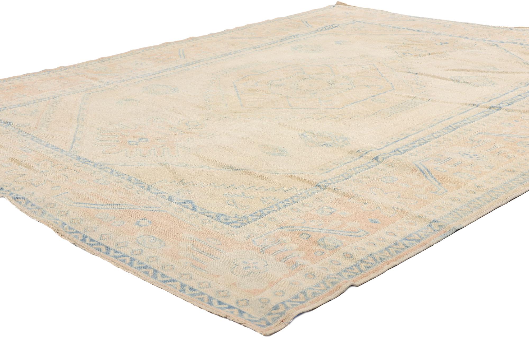 53706 Vintage Muted Turkish Oushak Rug, 06'06 x 08'05. Woven with whispers of the past and an air of timeless elegance, this hand-knotted wool vintage Turkish Oushak rug is a masterpiece of Anatolian artistry. Its softly abrashed ivory-beige field