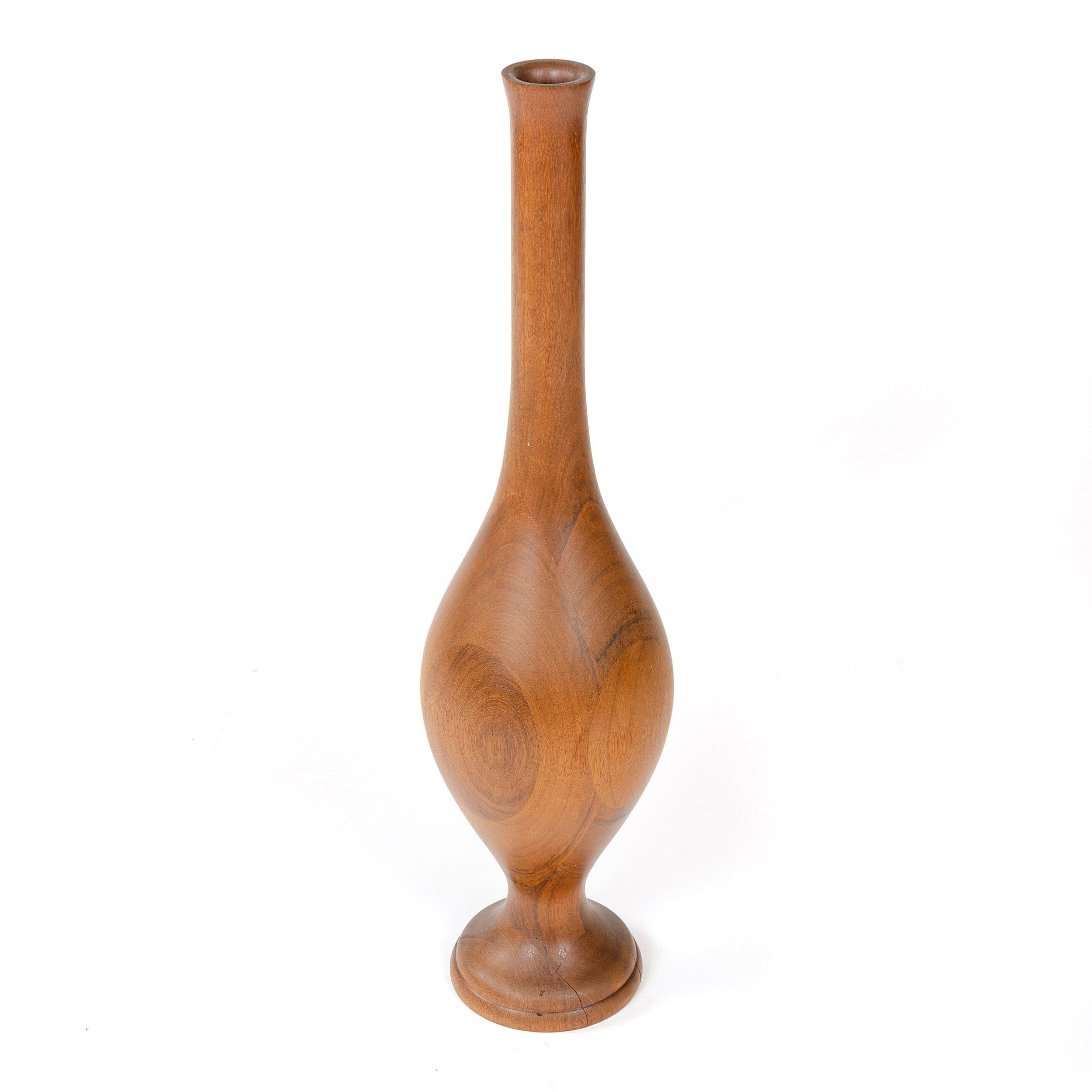 A substantial floor vase constructed of laminated solid wood. Signed 'M B' on the underside as depicted.