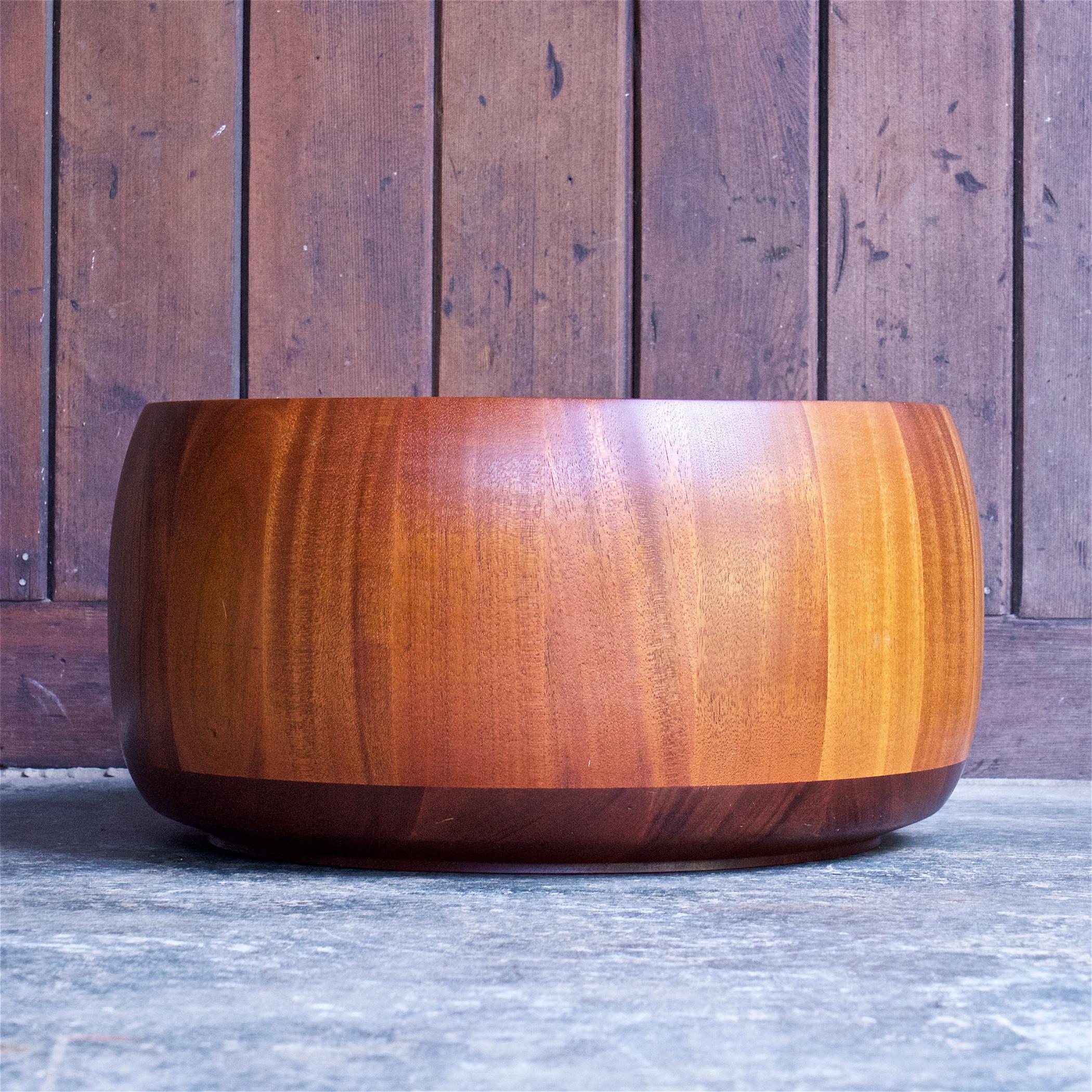 Beautifully constructed. A massive staved mahogany wood bowl, barrel, or planter. Condition is fair because there are 2 big dents to the rim, pictured.

Signed, John Crouse 1979 Wolcott NY.