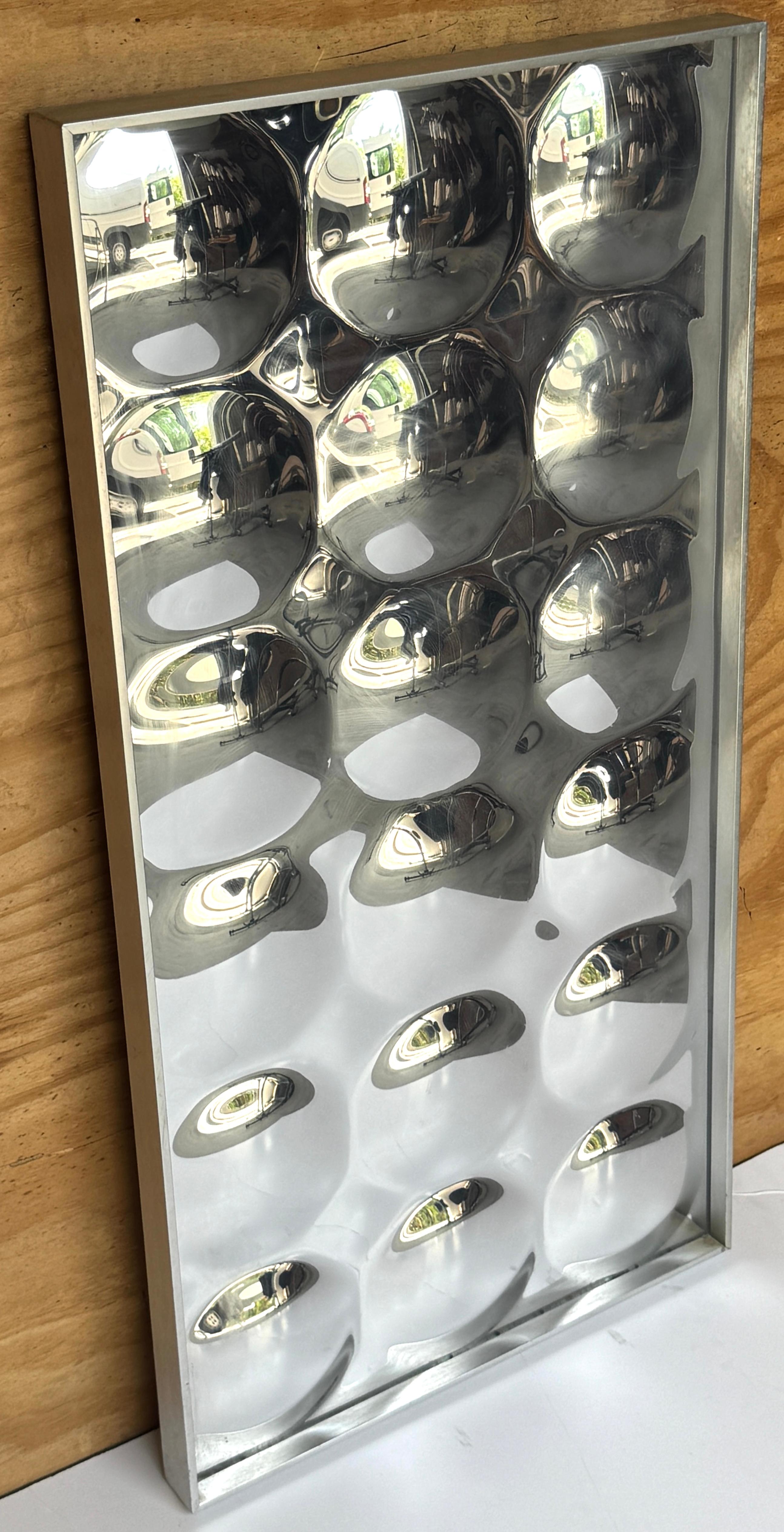 1970s Turner Bubble Mirror in Chrome-Finished Acrylic and Aluminum Frame
United States, circa 1970s. Can be hung vertically or horizontally. 

A visually captivating and sculptural 