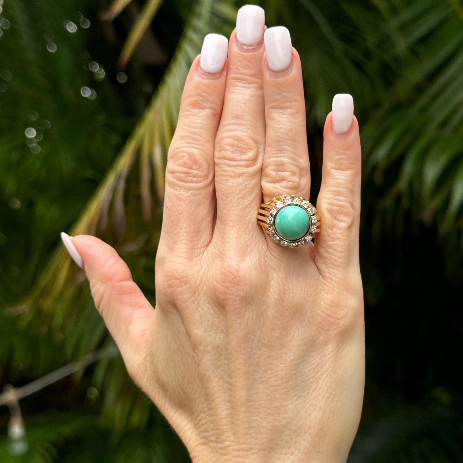 This bold 1970's cocktail ring features a captivating cabochon-cut turquoise at its center, set in 14-karat yellow gold. Surrounding the vibrant turquoise are sparkling diamonds with a total weight of 1.00 carat (H-I color and SI clarity), adding