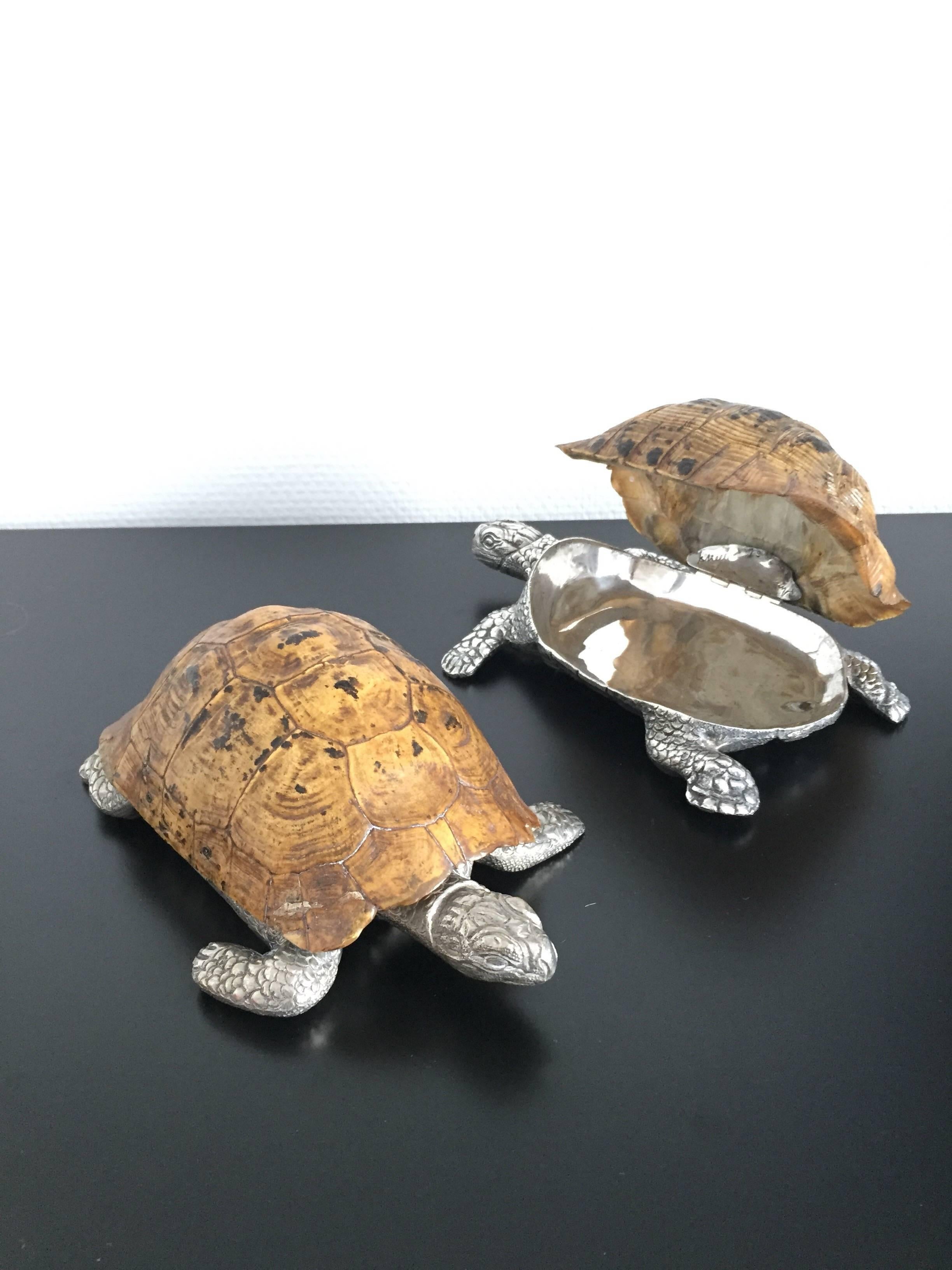 Two 1970s turtle boxes compose of real turtle and silver plated bronze. Box can be opened from the shell.
Each box is signed and numbered by Gabriella Crespi.
 