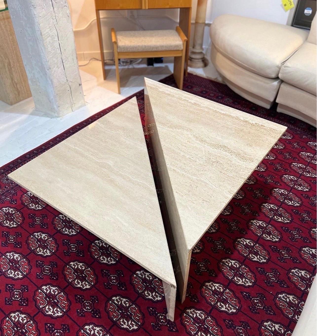 1970s Two Piece Modular Triangular Travertine coffee table

Italian two-tier triangular travertine coffee table, circa 1970s. Two separate triangular shaped tables can be configured together to form a square table or split apart and used