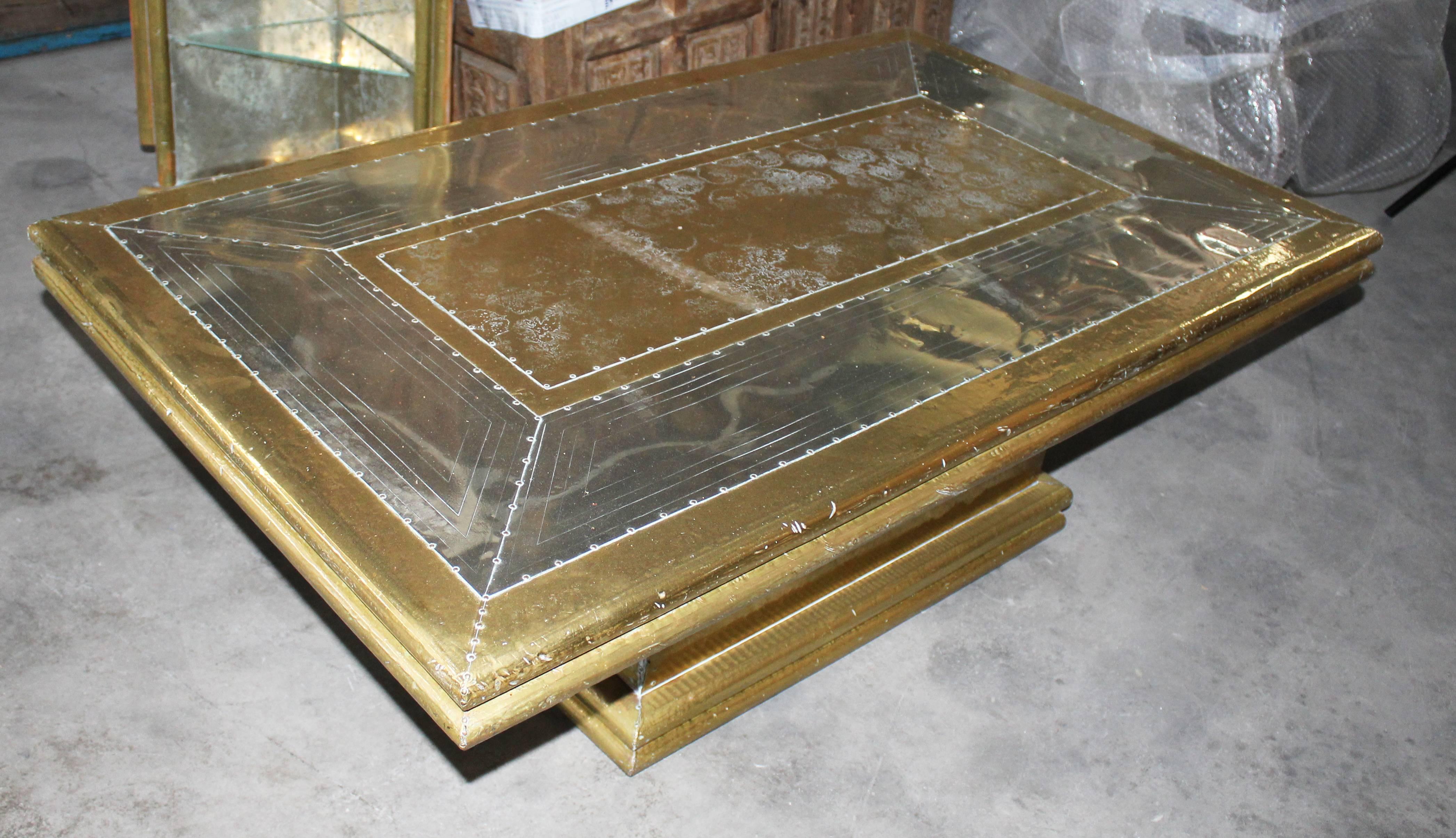 1970s two-tone gilded brass on wood designer coffee table from Marbella, Spain. A time when the Argentinian furniture designer Rodolfo Dubarry set up a workshop in Marbella and popularised the use of gilded brass with a mix of European and oriental