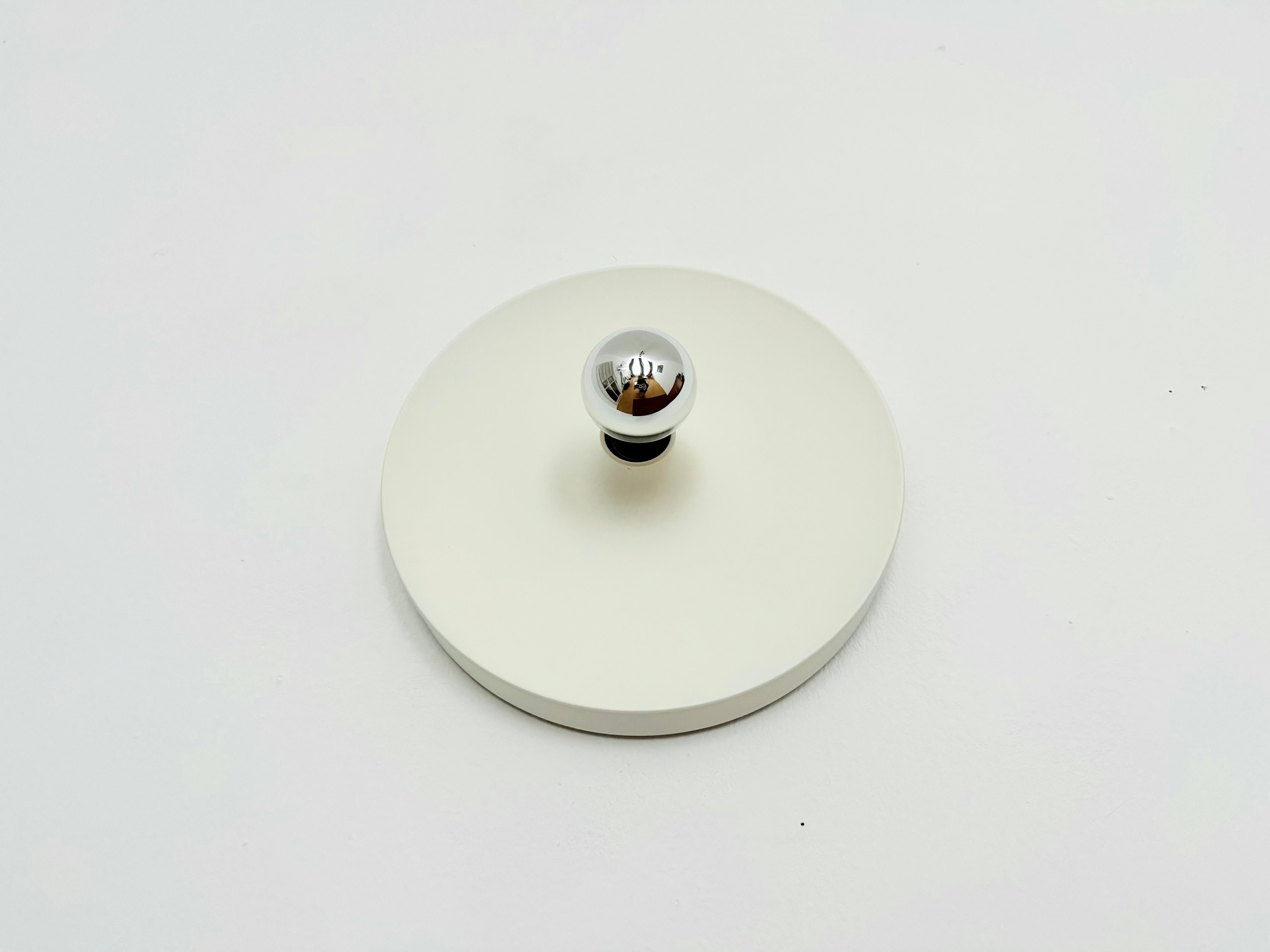 Very nice wall or ceiling lamp from the 1970s.
Beautiful, reduced design.
Very high-quality workmanship.

Condition:

Very good vintage condition with slight signs of wear and tear due to age.
Minimal signs of use.
Small paint damage on the