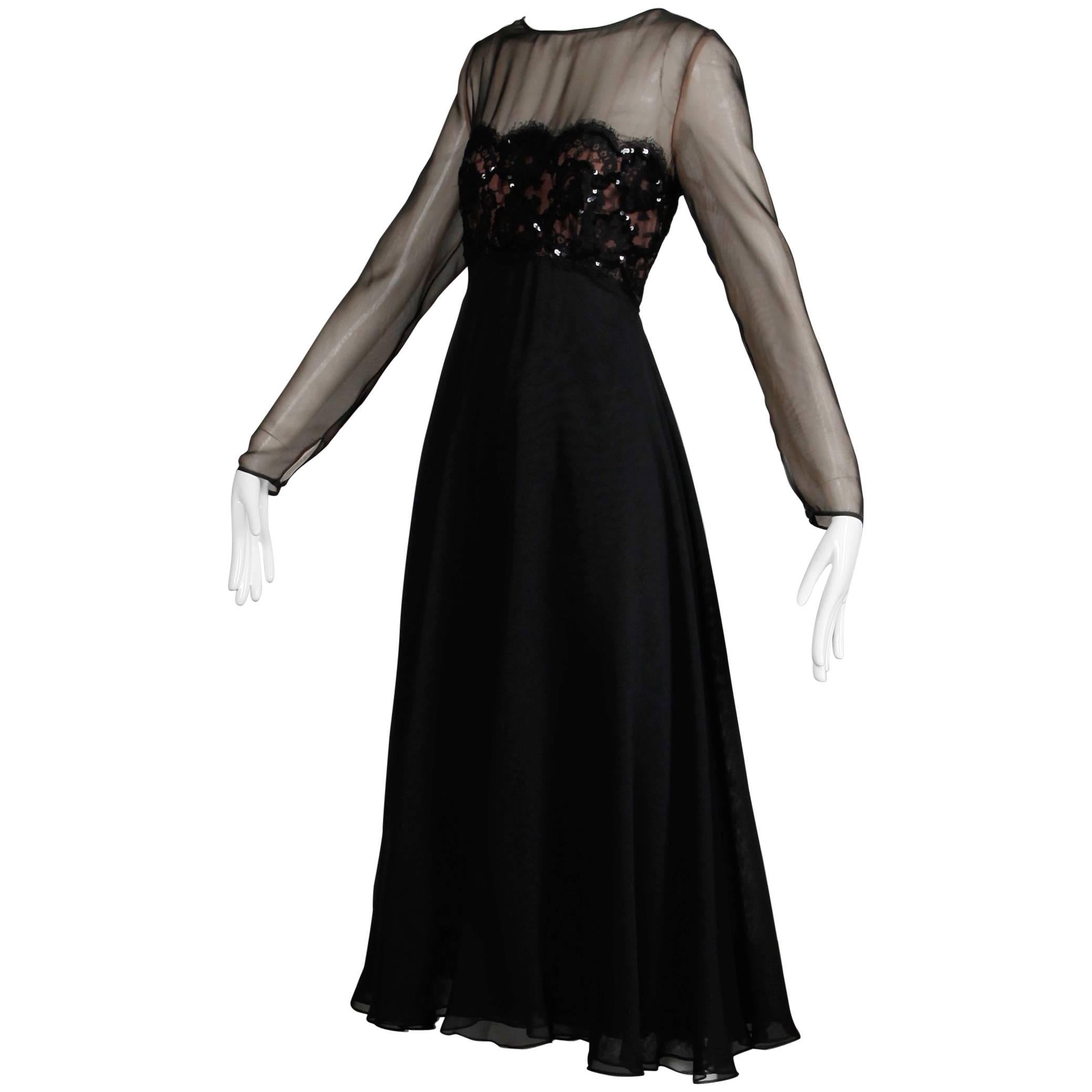 Gorgeous vintage 1970s black chiffon Estevez dress in unworn condition with the original tags still attached. Fully lined with rear zip and hook closure. The marked size is 10, but the dress fits like a modern small-medium. The bust measures 36