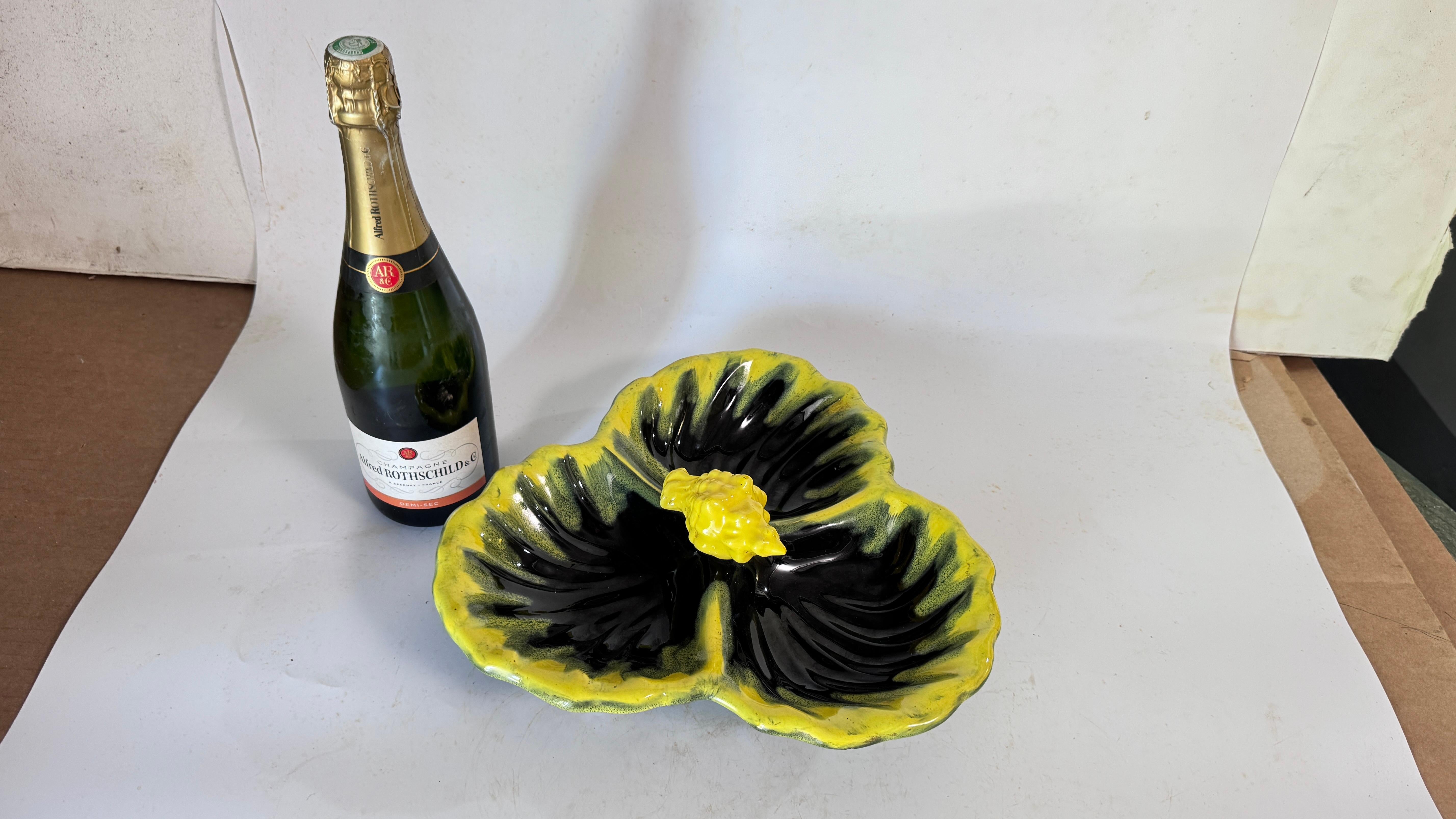 1970s Vallauris Yellow and Black Ceramic Catchall – Three Compartments with Lemon Motif – France

Description:
This is a vibrant ceramic catchall made in France, in the Vallauris region, during the 1970s. It features three separate compartments,