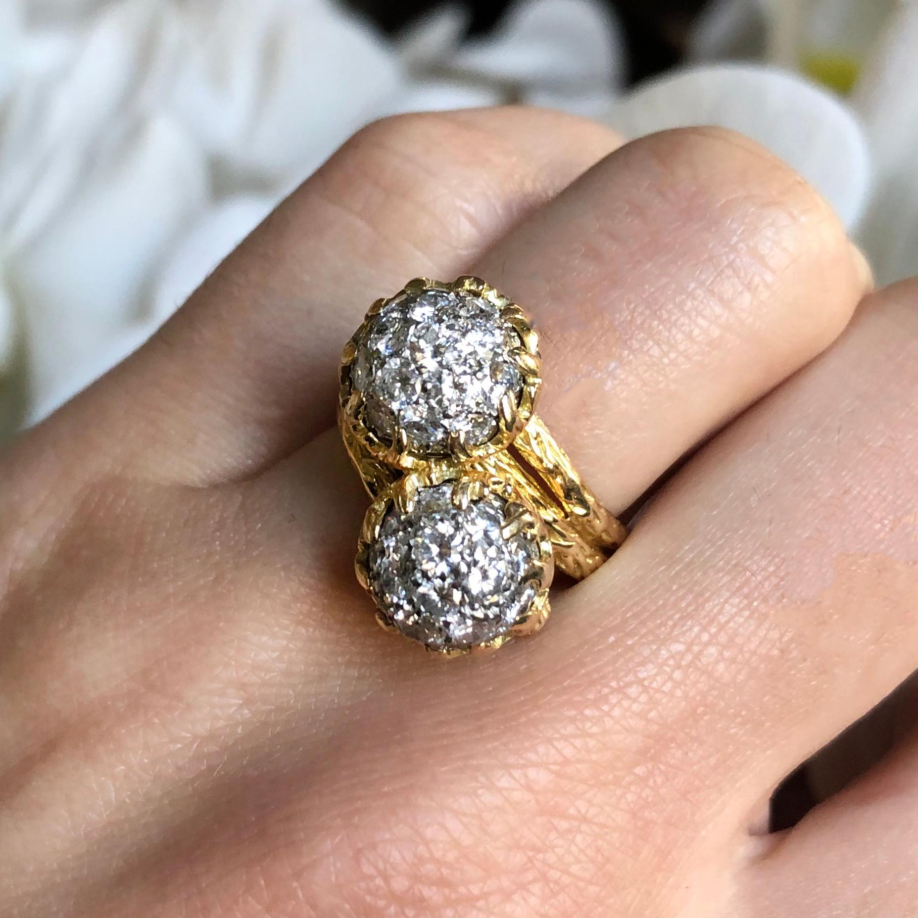 A pavé diamond and 18 karat gold bombé bypass ring, by Van Cleef & Arpels, 1970s

Signed VCA and stamped with © and 750. Numbered 64104903.

Size 6.5.