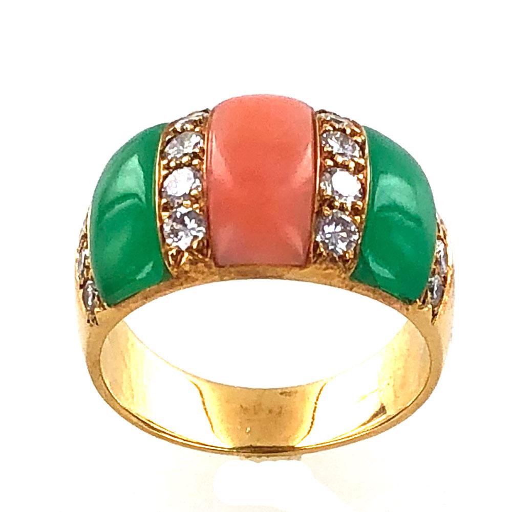 1970's diamond band ring by Van Cleef & Arpels. This colorful ring features 16 round brilliant cut diamonds (.80 carat total weight) that separate sections of coral and chrysophase gemstones. The band is fashioned in 18 karat yellow gold, measures