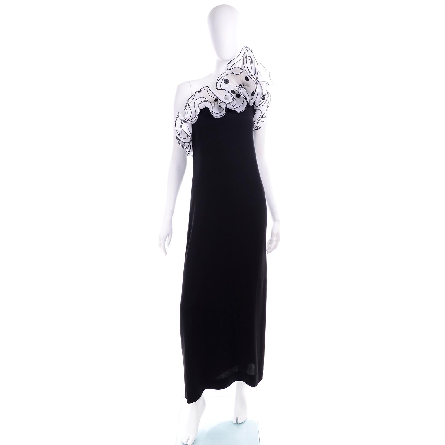 We love Victor Costa dresses! He created some incredible party dresses and we think they fit easily into any modern wardrobe! This long black one shoulder dress has fabulous black and white polka dot organza ruffles and a low back. This 1970's dress