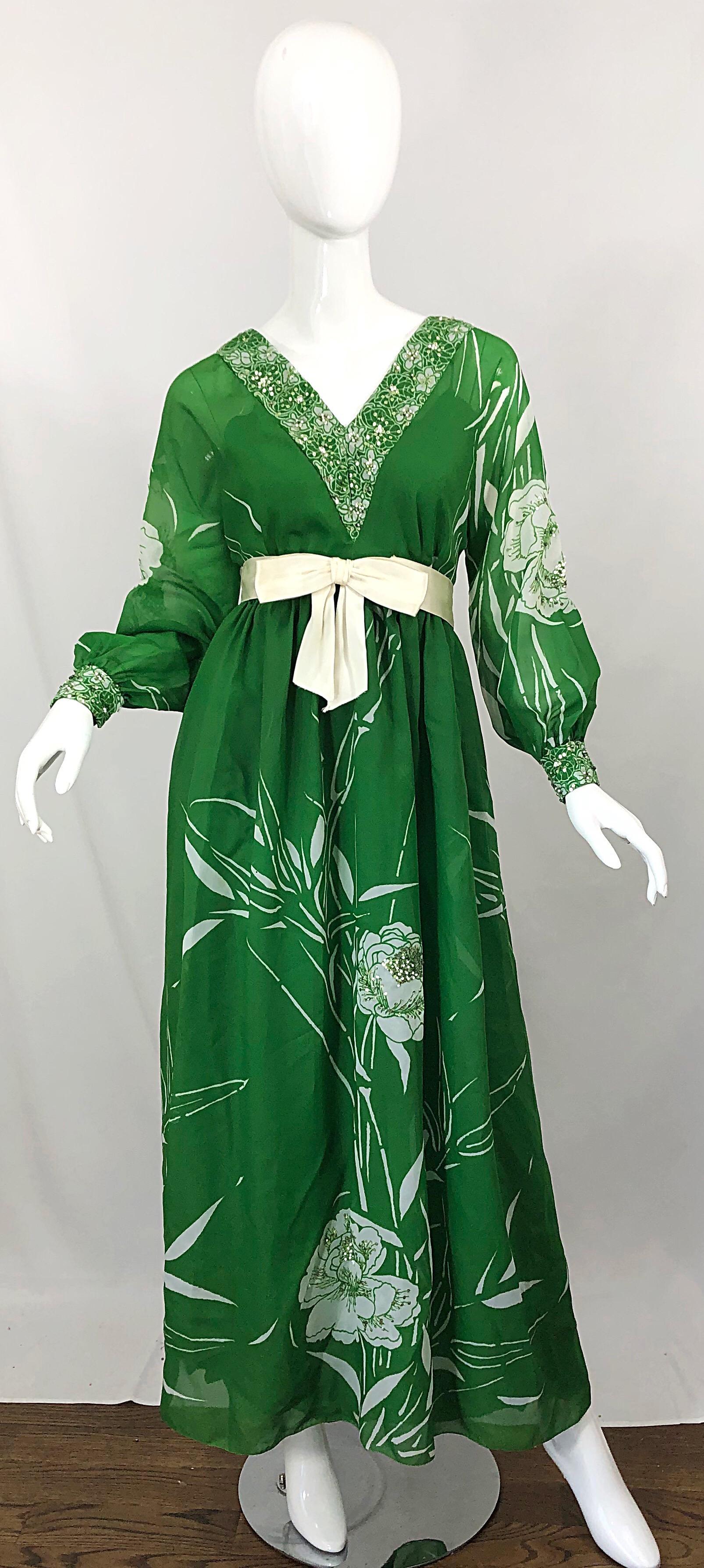Beautiful early 1970s VICTORIA ROYAL kelly green and white abstract floral sequined gown / maxi dress! Printed throughout the dress, sleeves, trim and cuffs. Hundreds of hand-sewn light green mini sequins and white beads alloverAttached green crepe