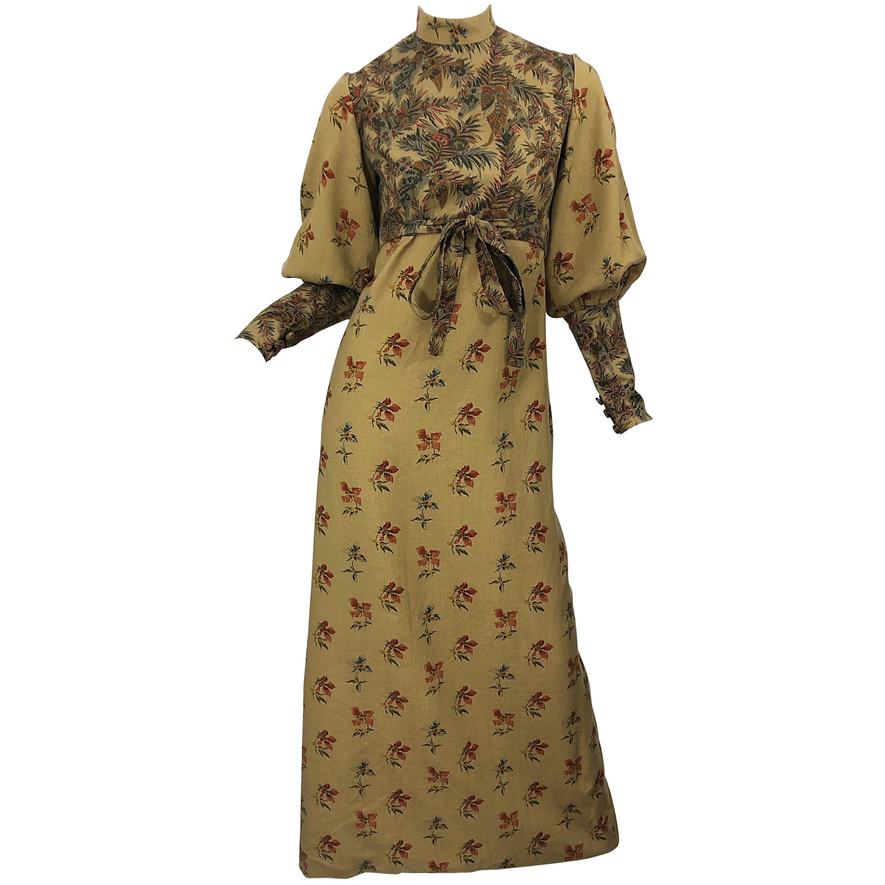 Beautiful 1970s Victorian inspired Autumnal lightweight wool challis long sleeve maxi dress ! Features warm tone of khaki, brown, red, burgundy, green and orange. Printed flowers and leaves throughout. High neck with bishop sleeves. Hidden zipper up