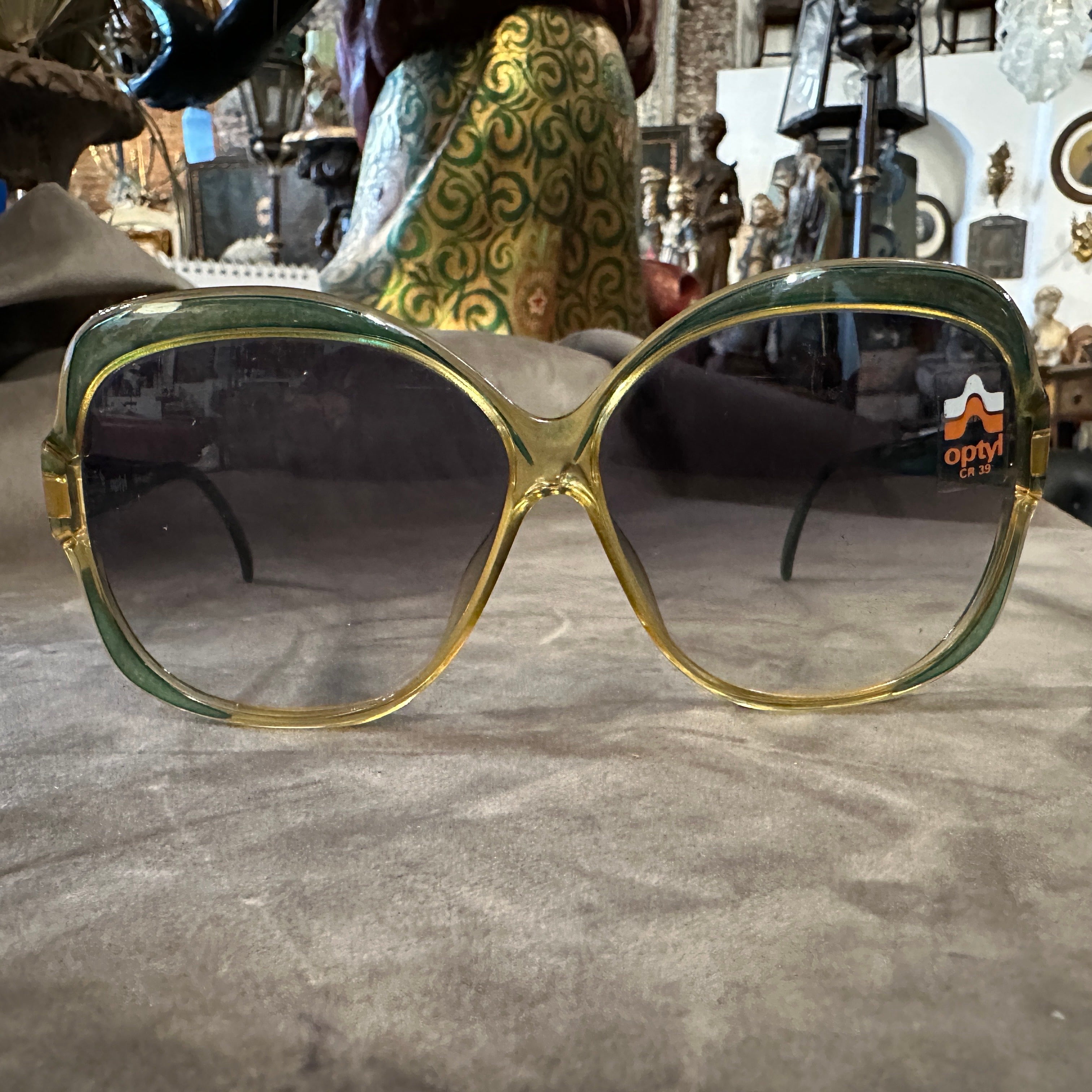 These vintage Viennaline sunglasses are a quintessential example of 1970s eyewear glamour. Made by Optyl, a brand renowned for its innovative and high-quality frames, these sunglasses are a statement piece that exudes retro chic. The most prominent