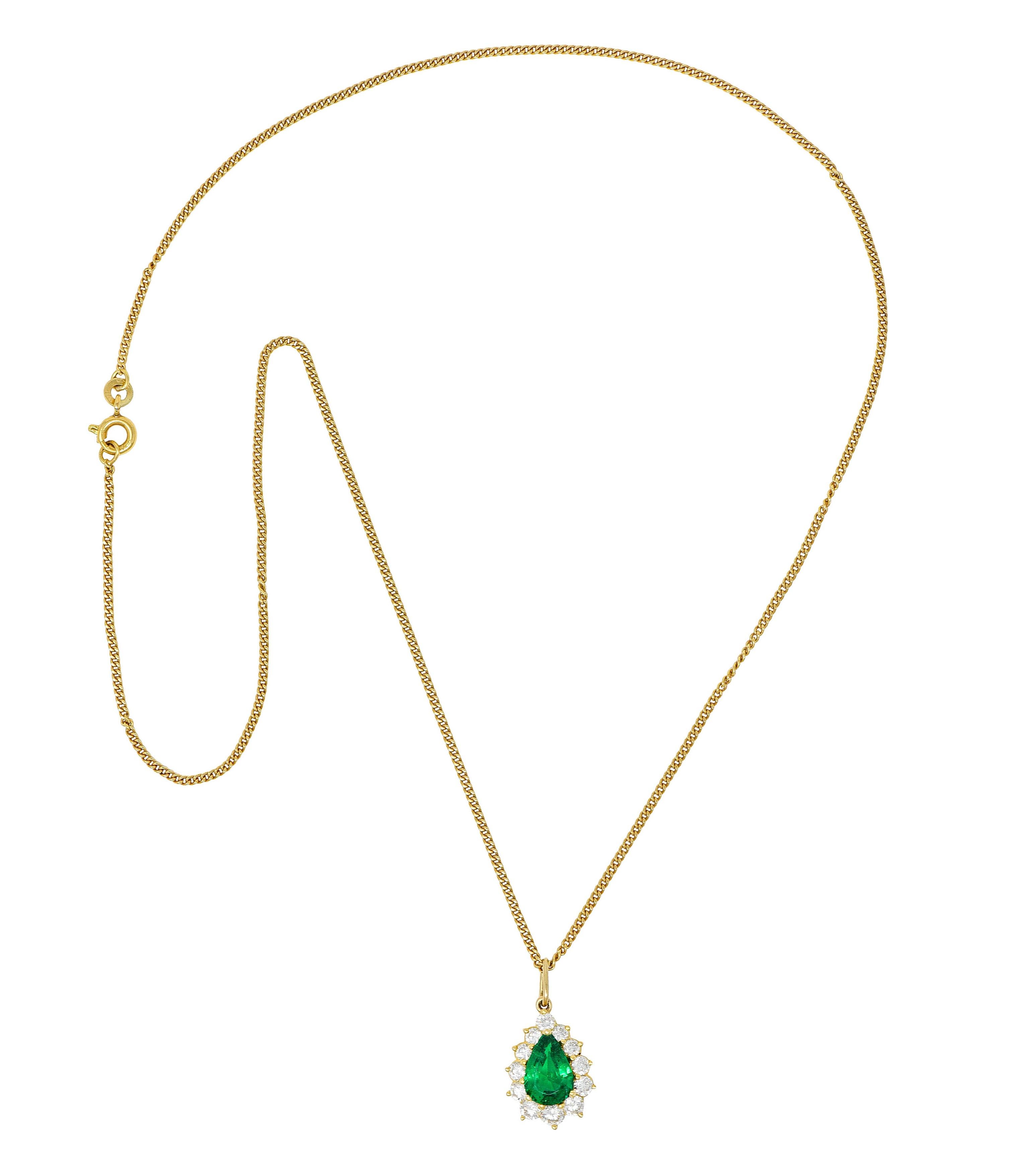 Curb chain necklace suspends a pear shaped cluster pendant

Featuring a pear cut emerald weighing approximately 2.15 carats

Bright green in color and semi-transparent with natural inclusions

Zambian in origin with minor traditional clarity