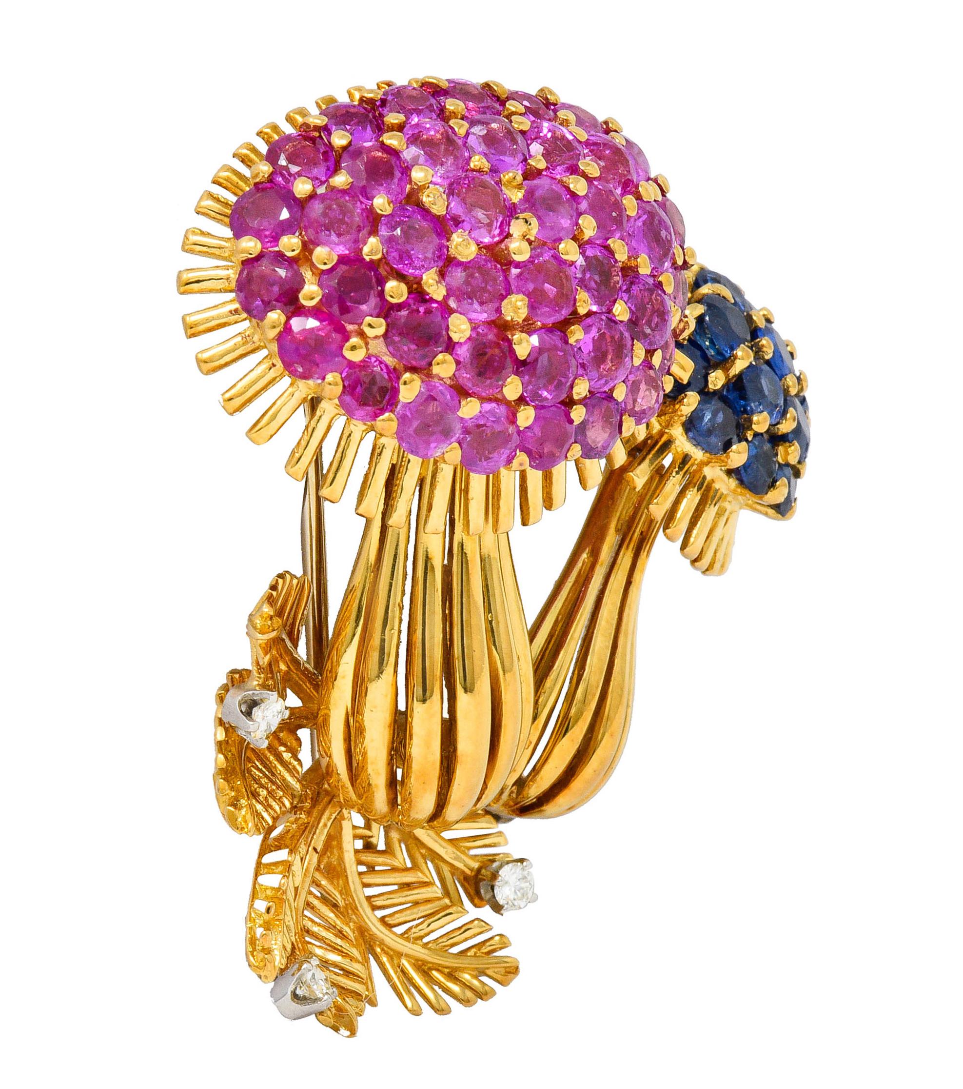 Brooch is designed as two mushrooms with stylized gold wire composition

Mushroom tops are prong set with bright pink and blue sapphires that weigh in total approximately 8.50 carats

With a concave fern formation at base accented by three round