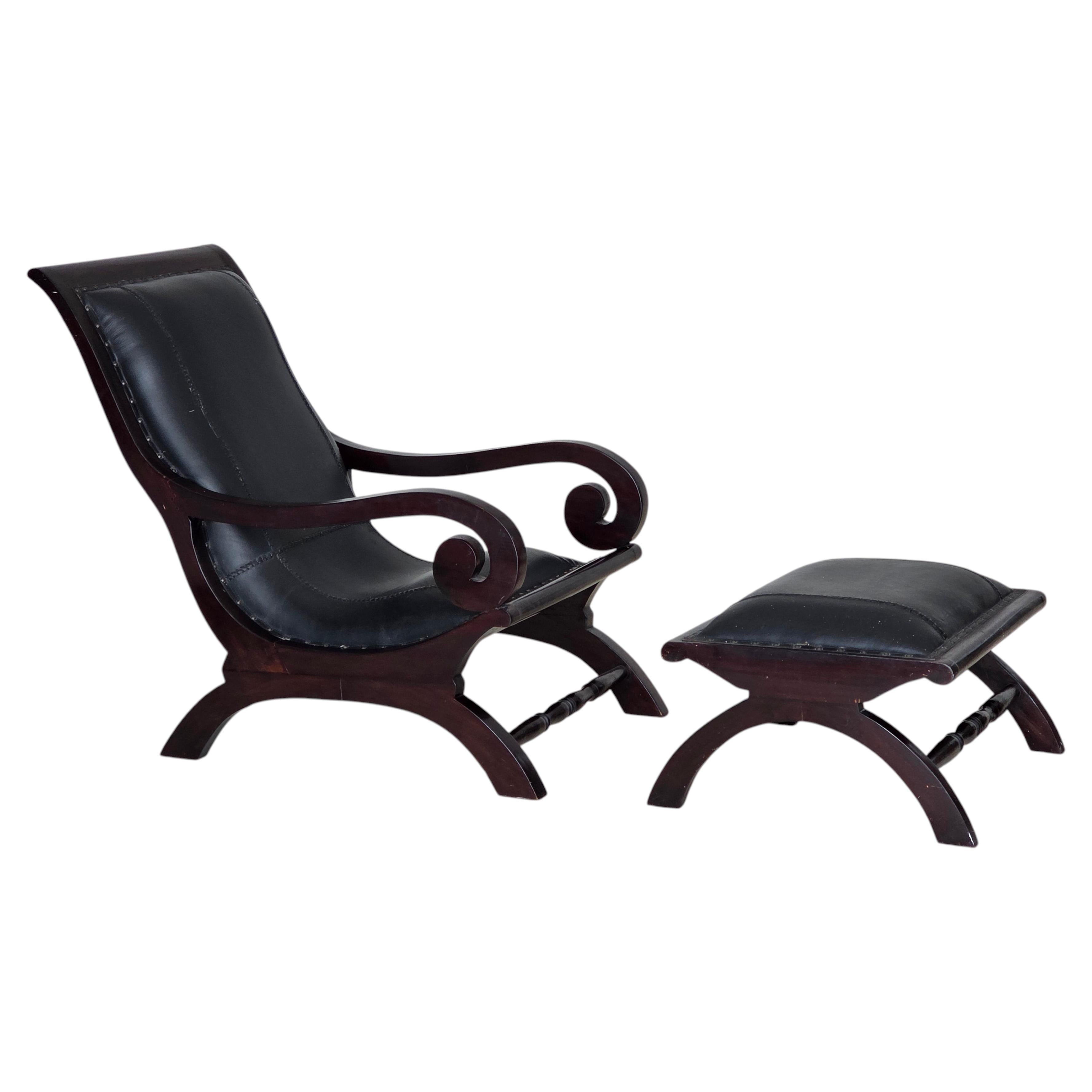 1970s, vintage armchair with footstool, black furniture leather. For Sale