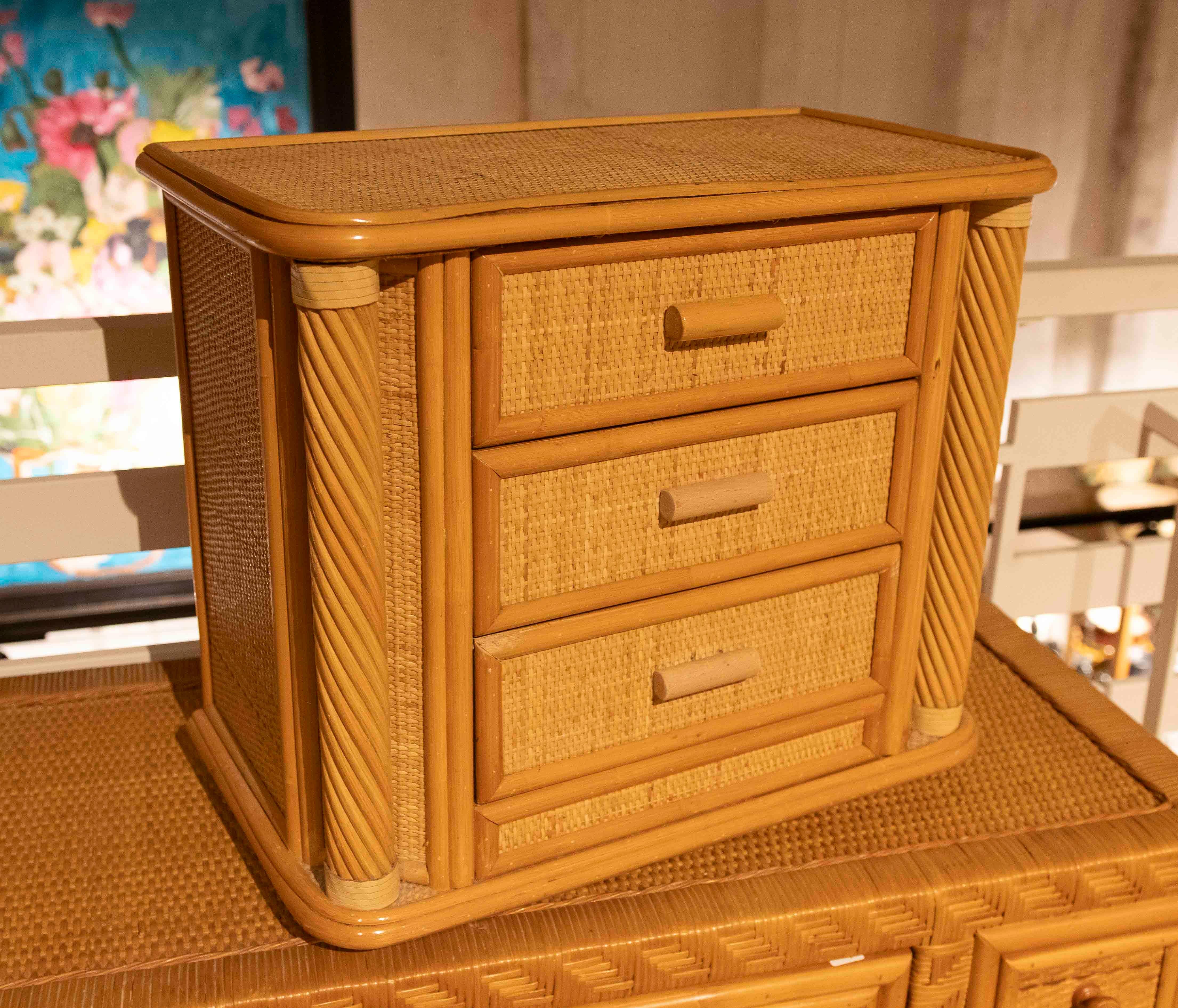 Charming vintage chest of drawers crafted from bamboo with rattan lattice drawer fronts, a piece that reflects the natural, lightweight design typical of mid-20th-century tropical furniture.

The piece features three spacious drawers, ideal for