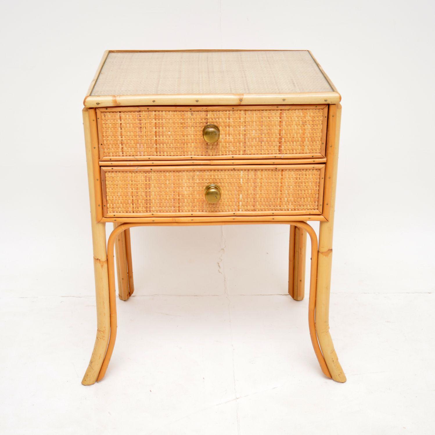 A beautiful two drawer side table with a bamboo and rattan frame. This was made in England, it dates from around the 1970-1980’s.

The quality is excellent and this is a very useful size. It is perfect for use as a bedside table or occasional side