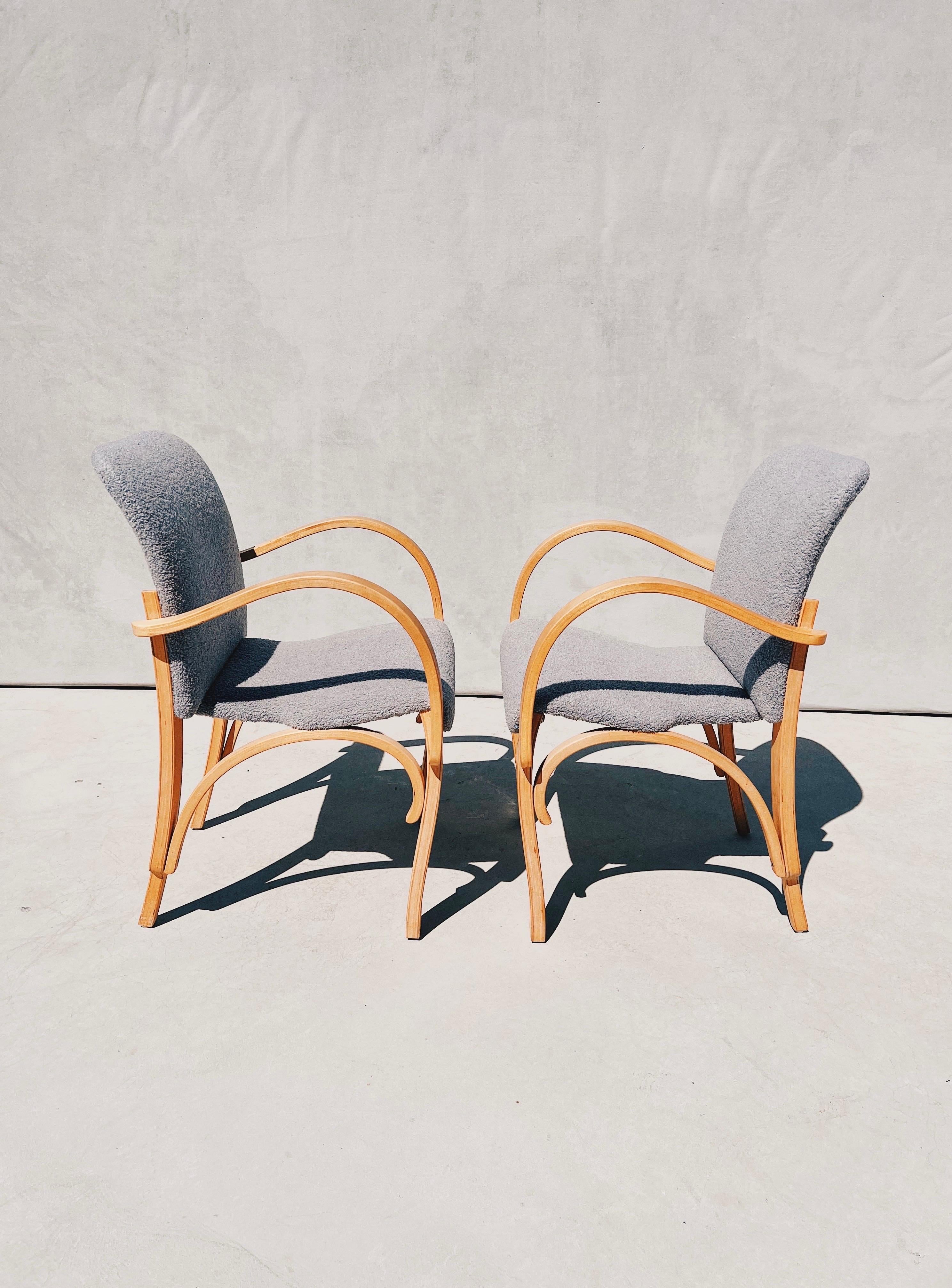 1970s Vintage Bentwood Chairs Reupholstered in Gray Bouclé, a Pair

A sculpturally stunning pair of bent plywood chairs. 

Each chair is crafted like a puzzle- intricate yet simple, poised and refined

One piece of golden blonde plywood at a time-